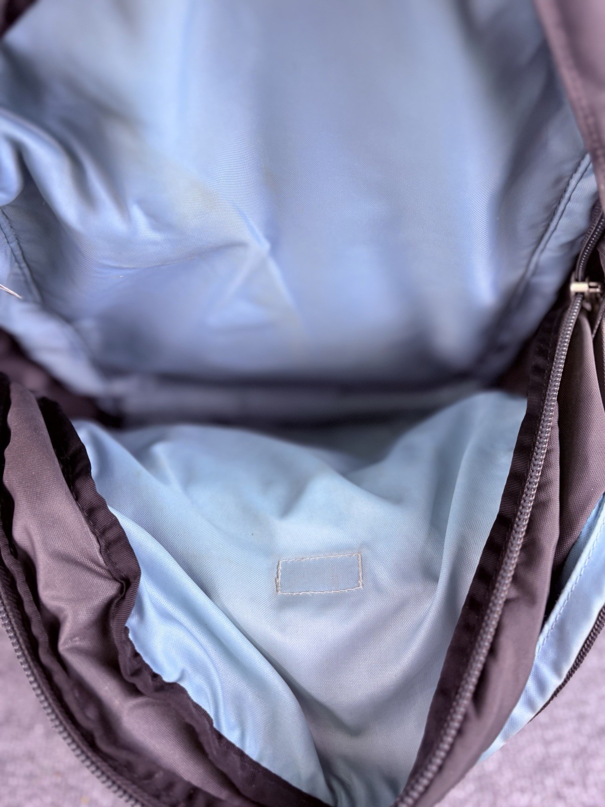 The North Face Surge Backpack Sky Blue Front Grey Back And Green Side Pockets