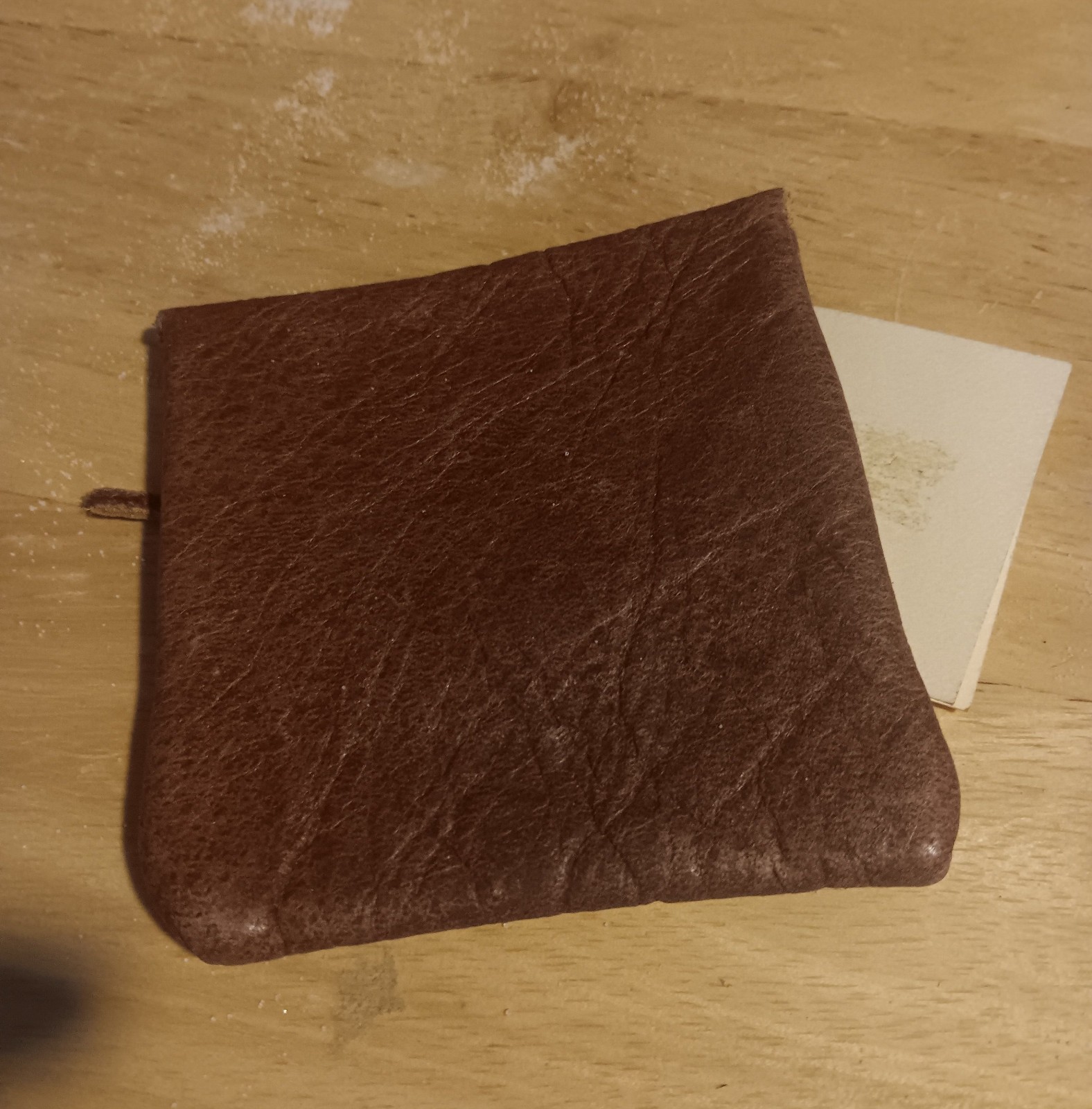 handcrafted leather pouch from the Yukon, secured with bone button 3.5″x3.5″