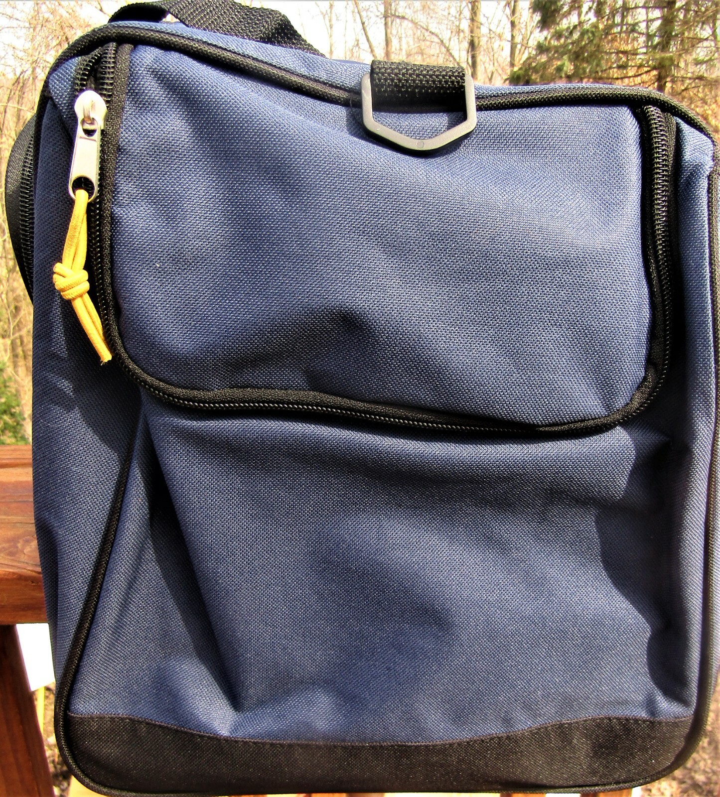 Trailmaker canvas duffel bag, blue and black, measures 24″ X 12X 11 1/2.