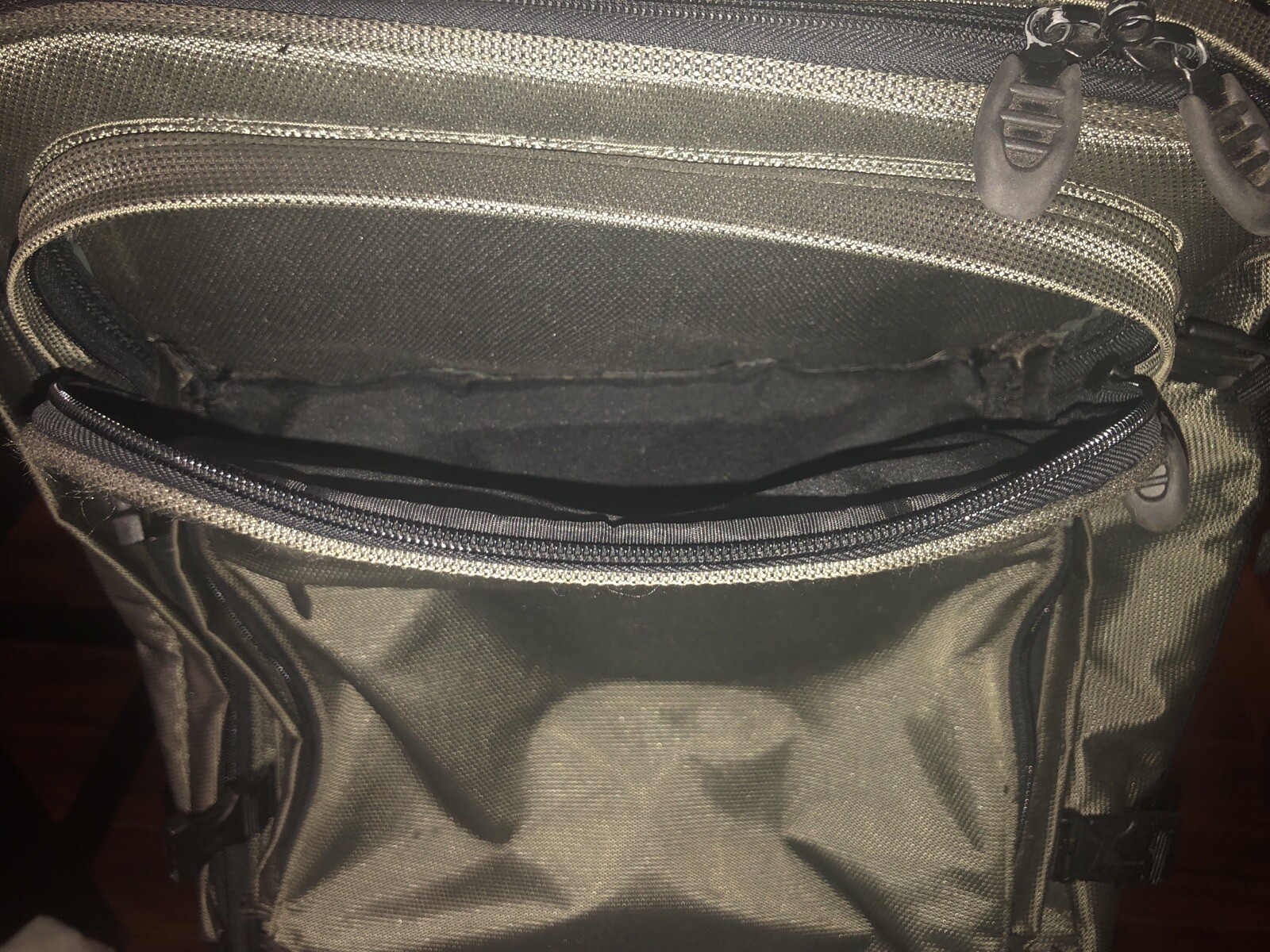 Used Tumi T2 Nylon Olive Green and Black Backpack Suitcase With Wheels.