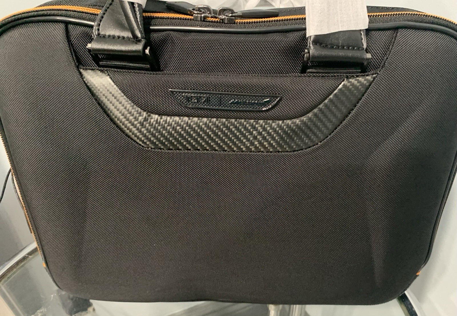 TUMI MCLAREN Axle Slim Brief $1095 Black/Orange