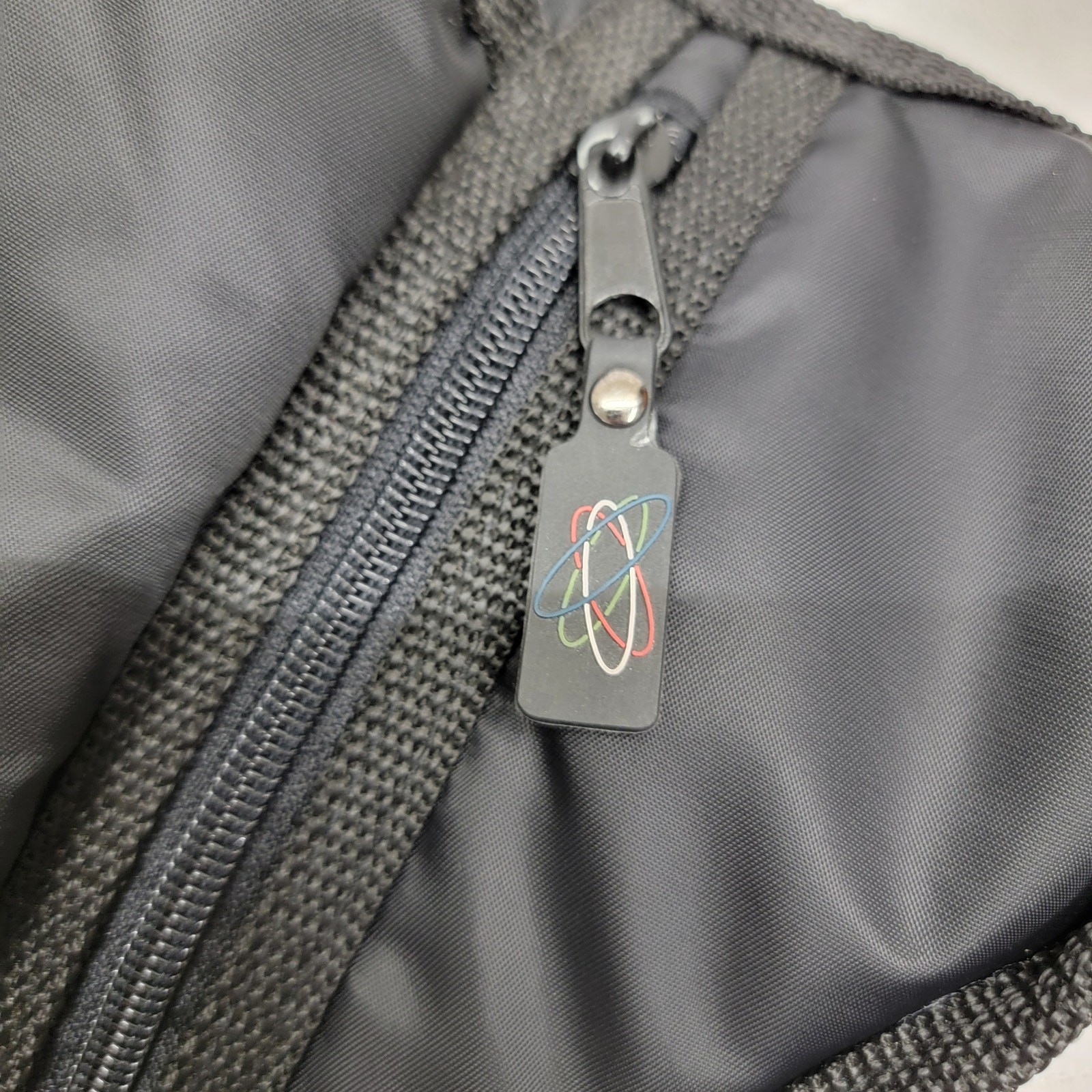 Vintage Y2K Black Nylon Sling Messenger Bag Techwear Quilted Atomic Logo Cyber