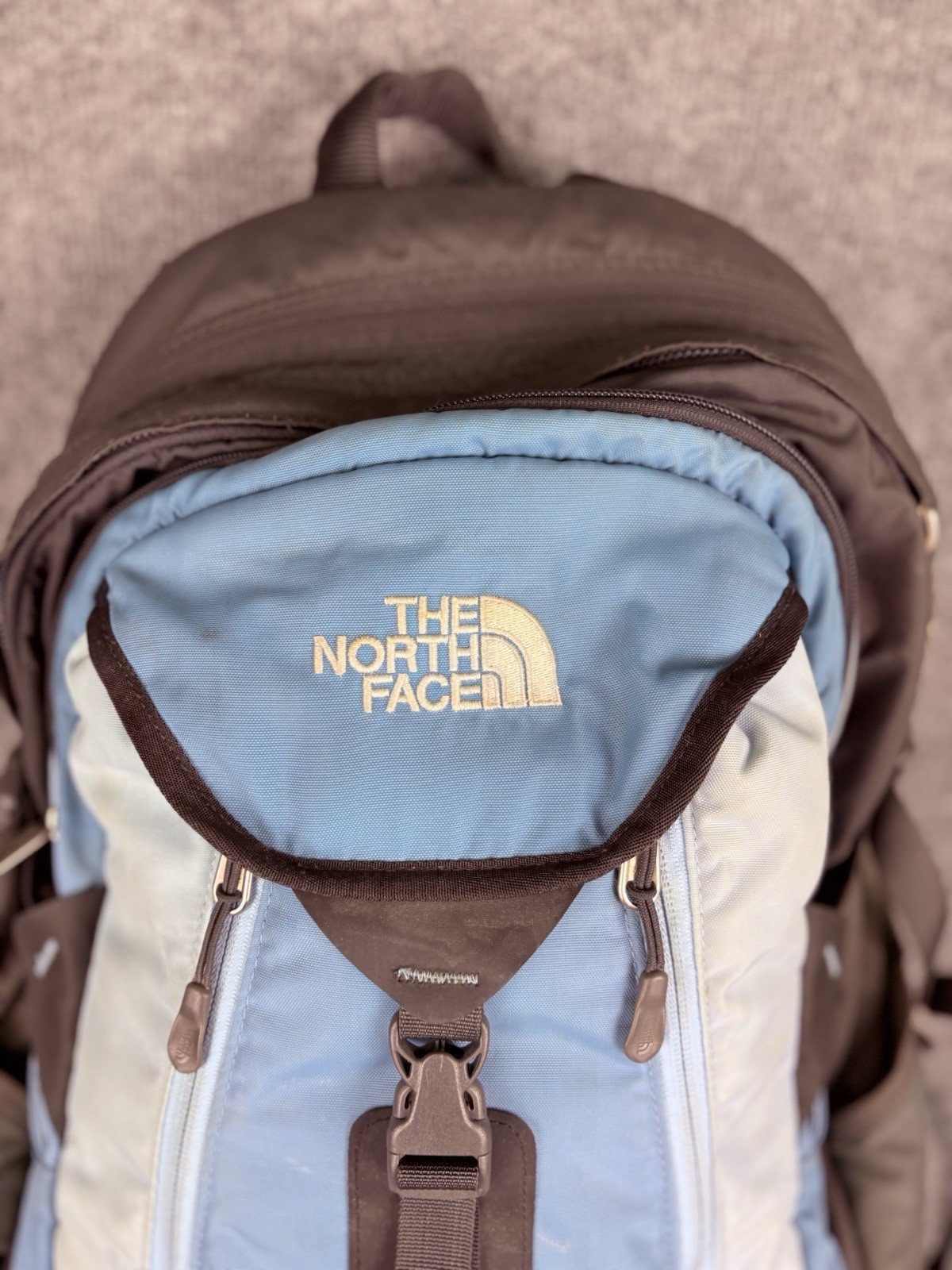 The North Face Surge Backpack Sky Blue Front Grey Back And Green Side Pockets
