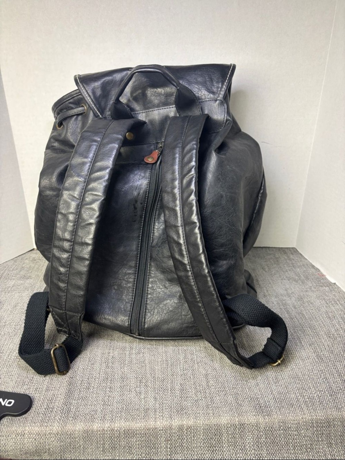 Tandem Black Leather Drawstring Backpack with Buckled Flap Cascade Falls