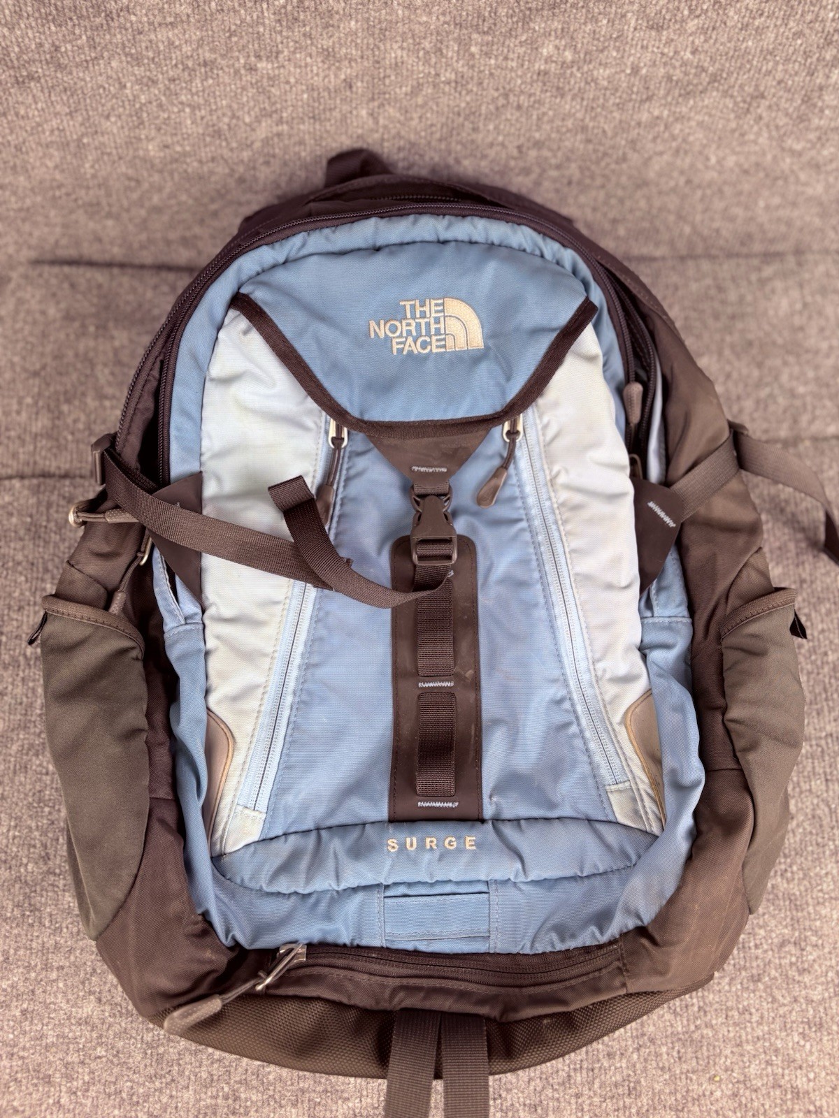 The North Face Surge Backpack Sky Blue Front Grey Back And Green Side Pockets