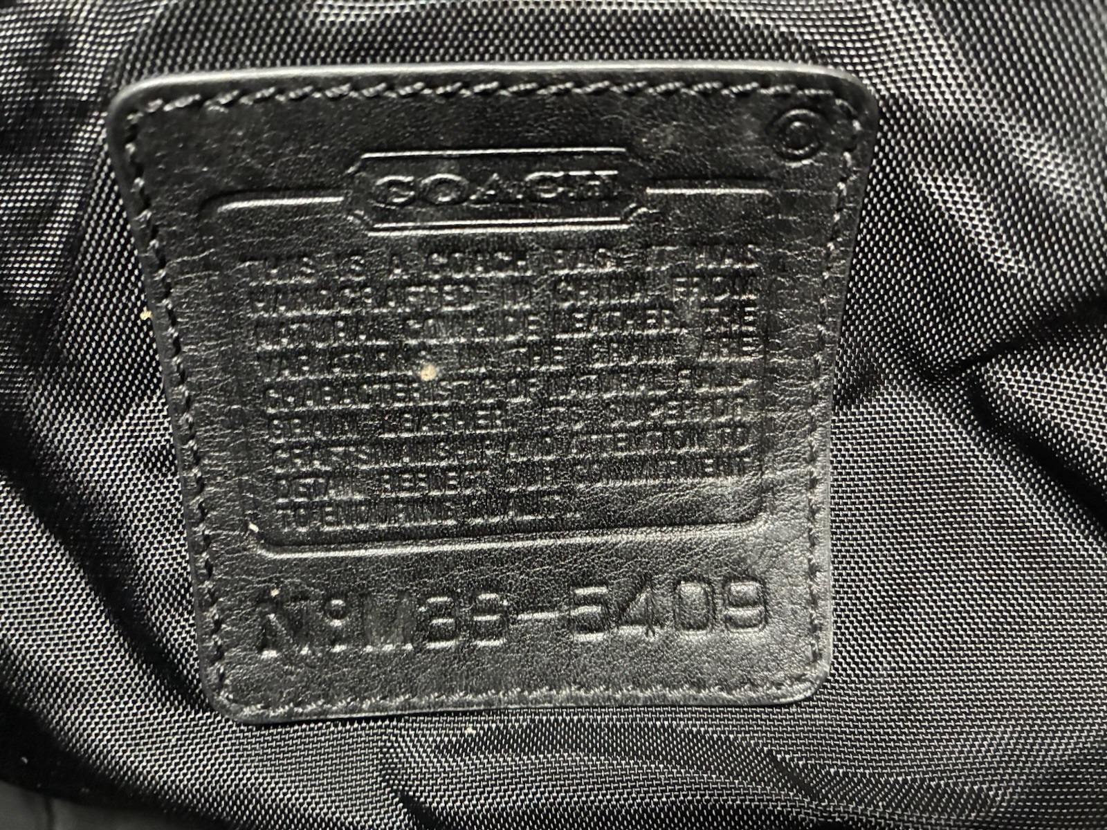 COACH BLACK LEATHER DUFFLE BAG: APPROX. 22″ X 11″ X 9″
