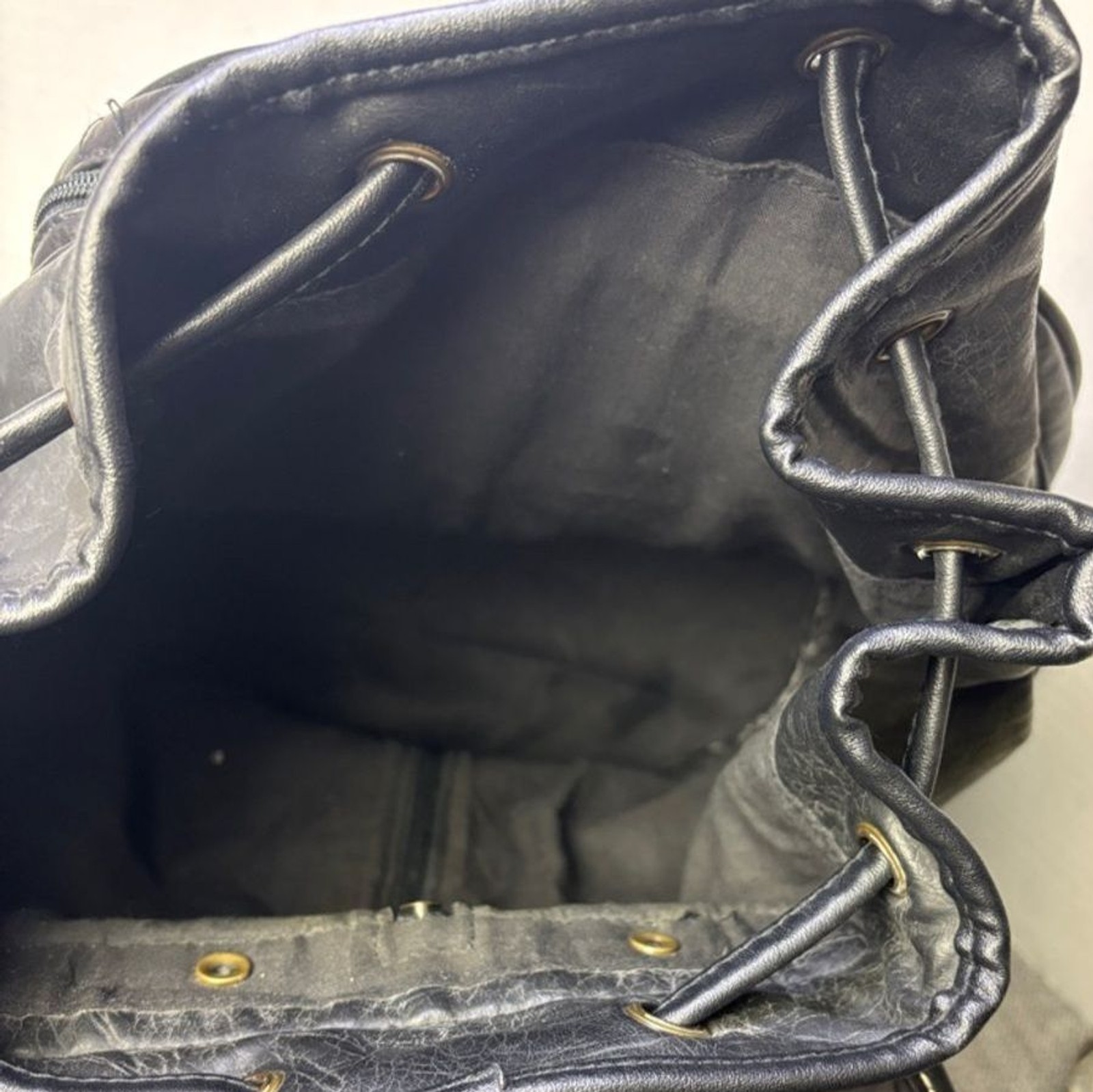Tandem Black Leather Drawstring Backpack with Buckled Flap Cascade Falls