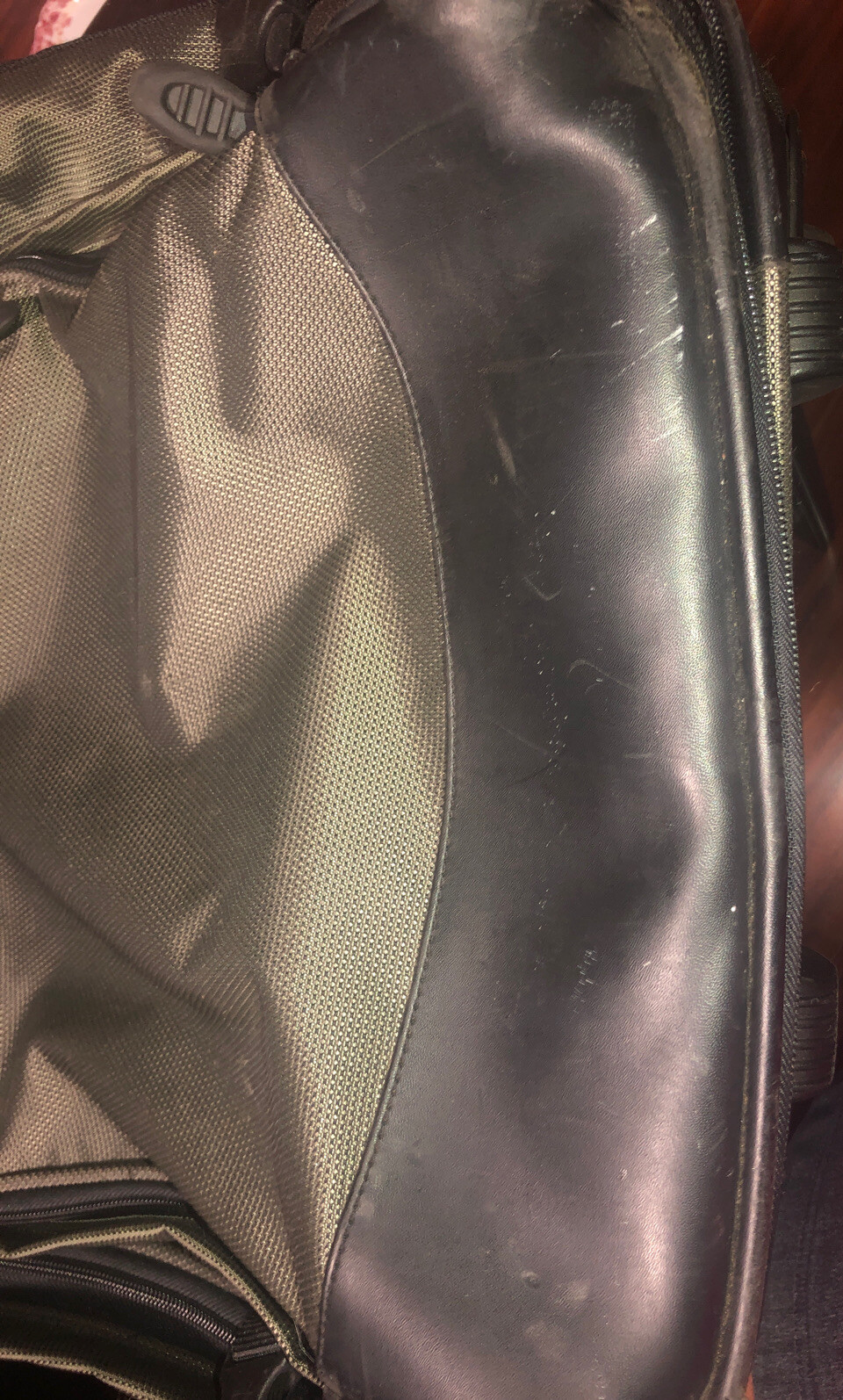 Used Tumi T2 Nylon Olive Green and Black Backpack Suitcase With Wheels.