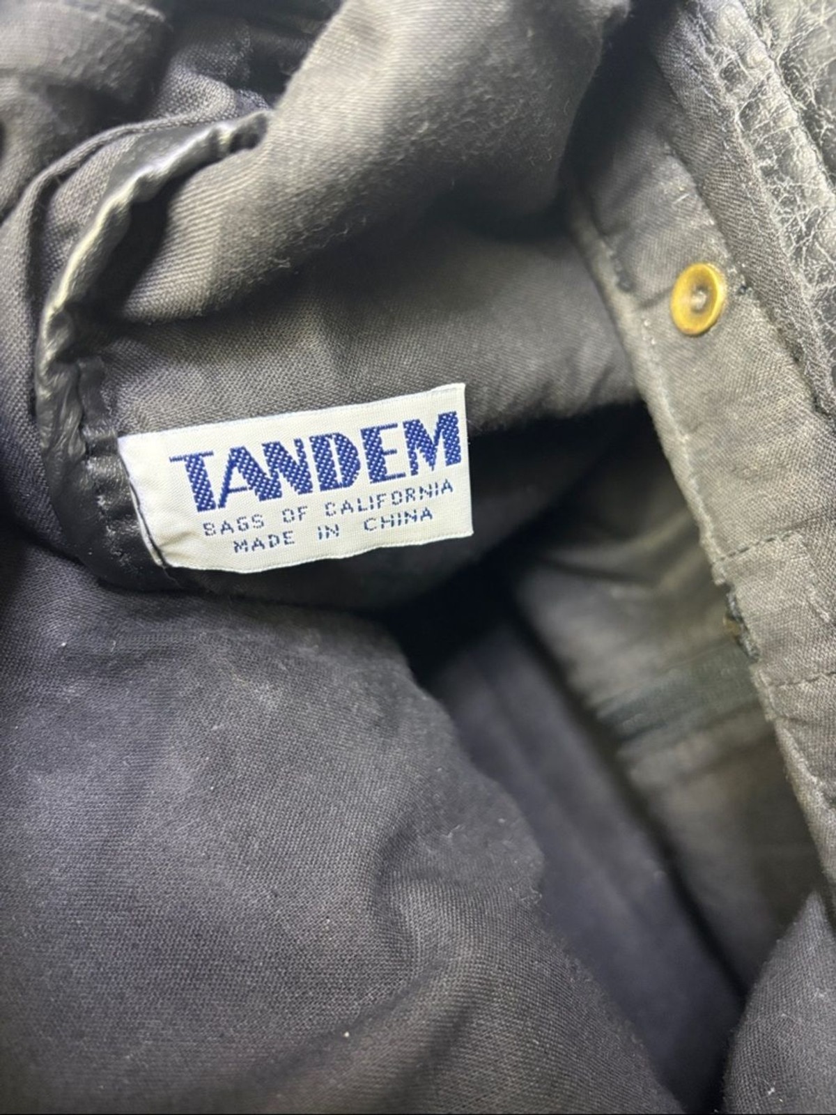 Tandem Black Leather Drawstring Backpack with Buckled Flap Cascade Falls