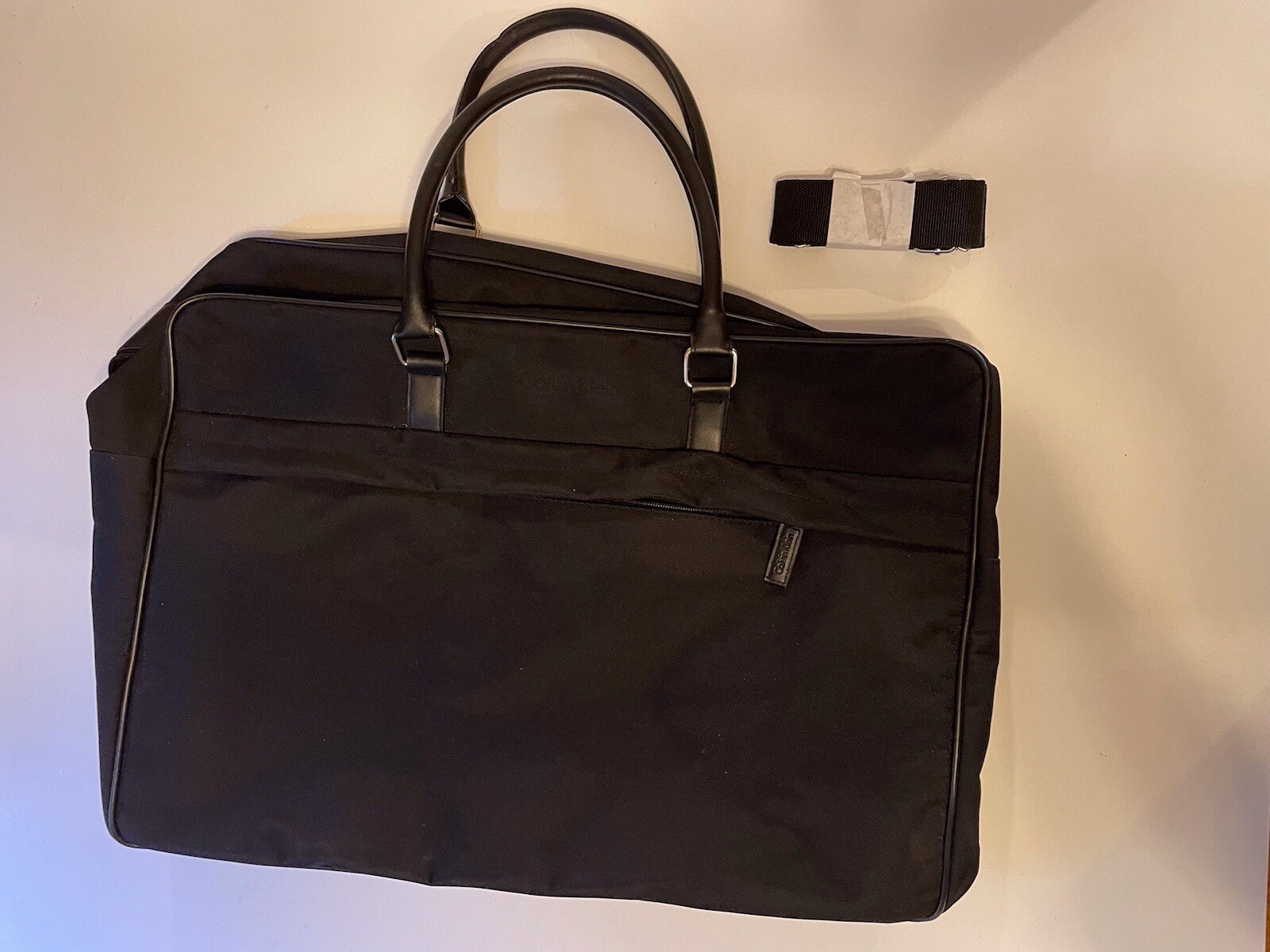 Calvin Klein 100% Polyester travel duffle bag black, shoulder strap, And Handles