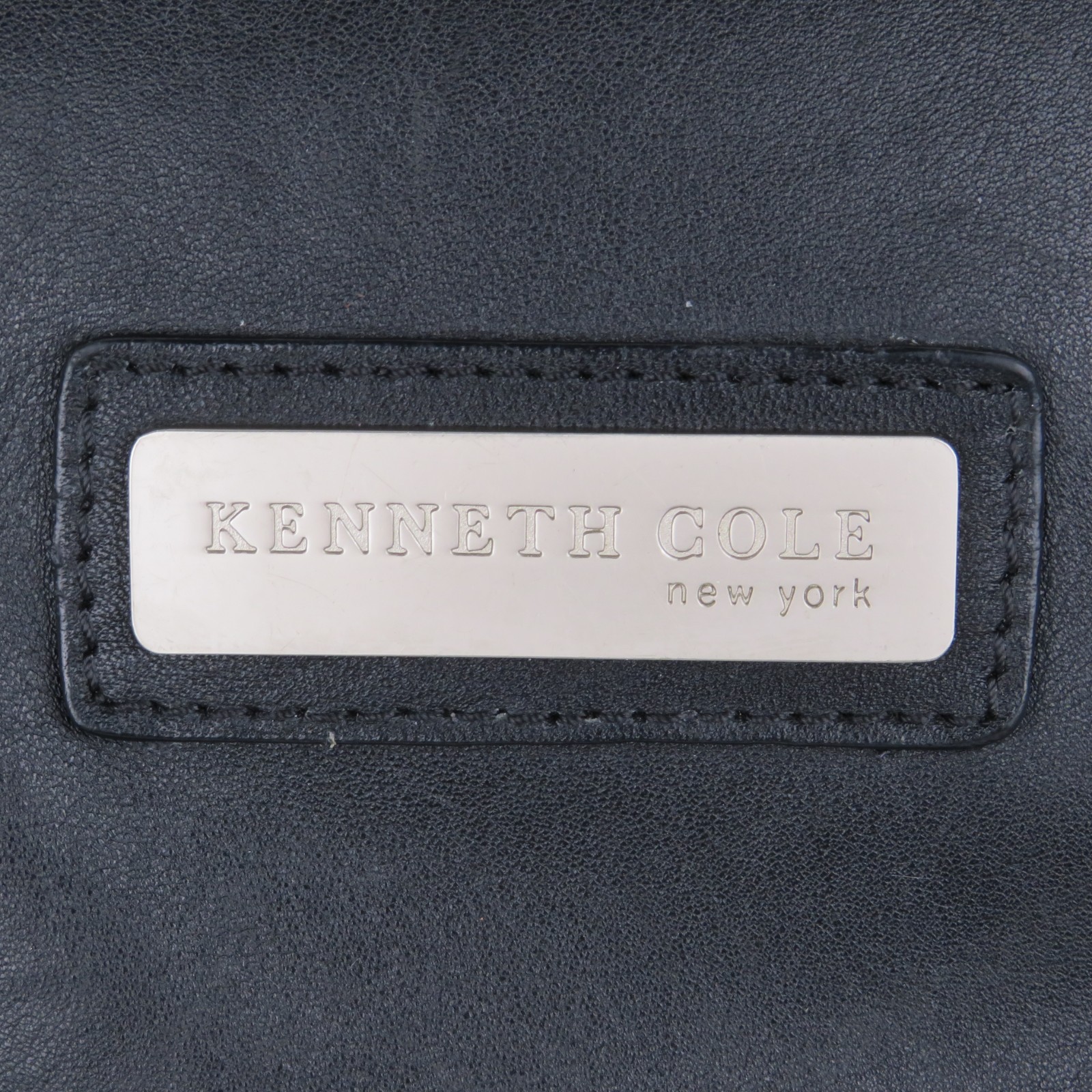 Kenneth Cole Black Leather Backpack Zipper Flap Padded Adjustable Straps Roomy