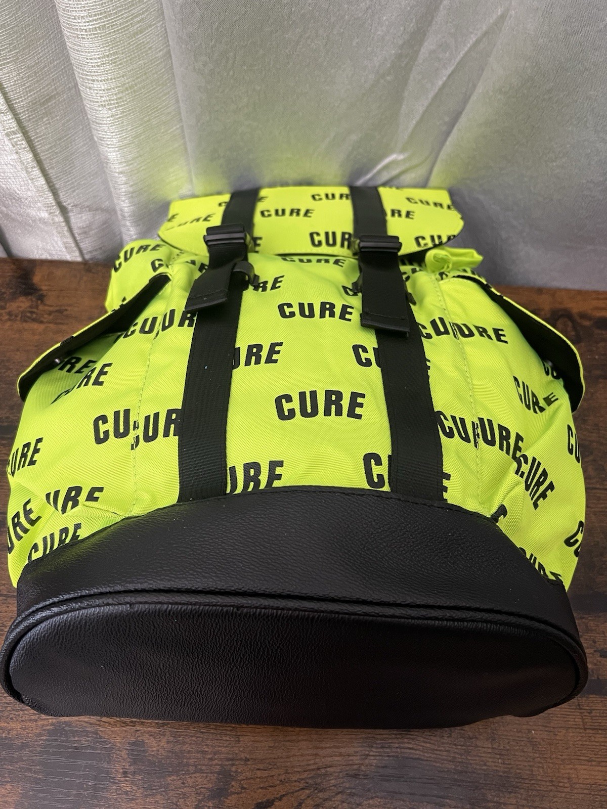 Green/Black CURE Logo Print Backpack Drawstring Buckle Adjustable Straps