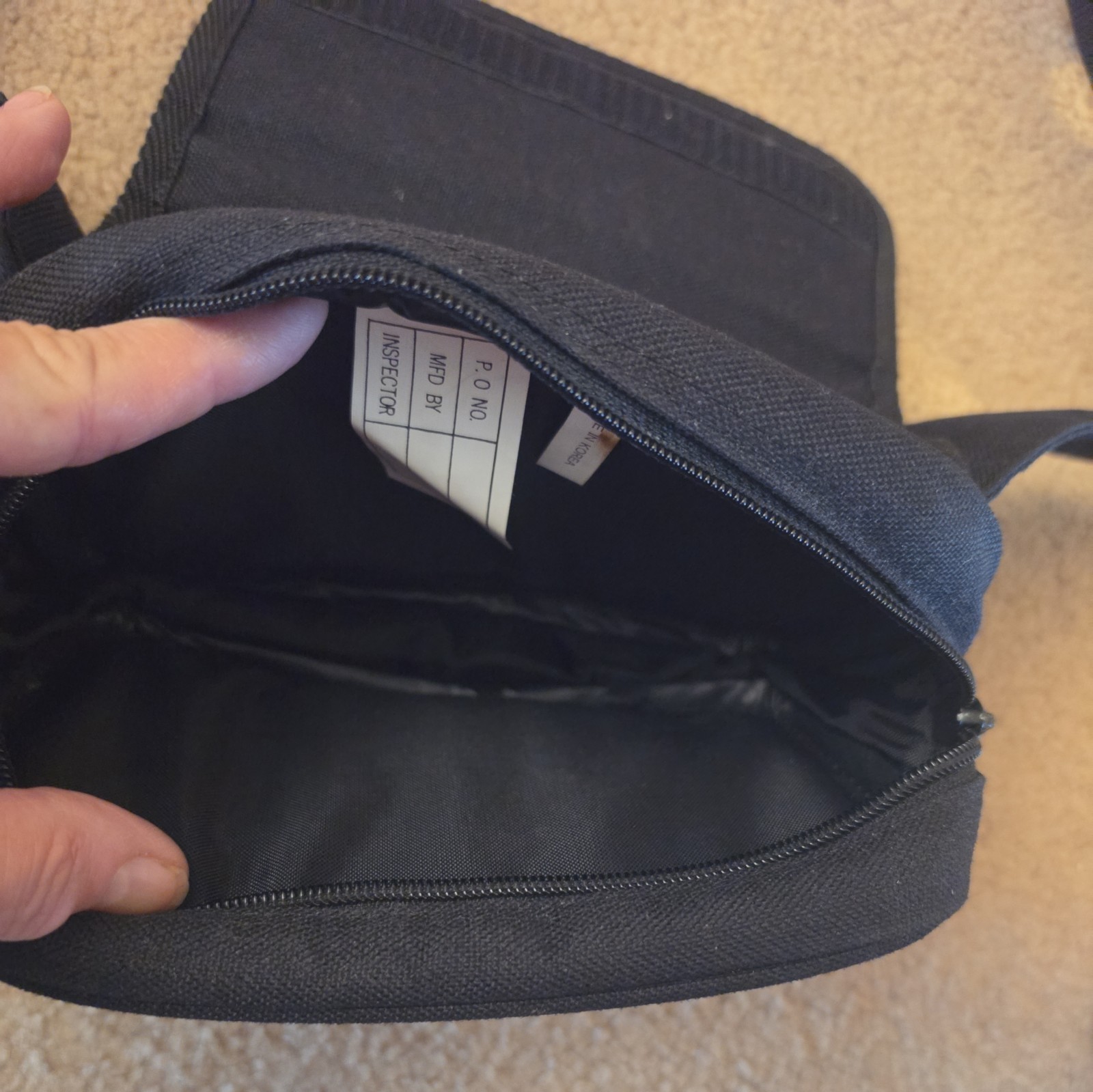 Triumph Motorcycles over-the-shoulder single-strap sling fanny bag black