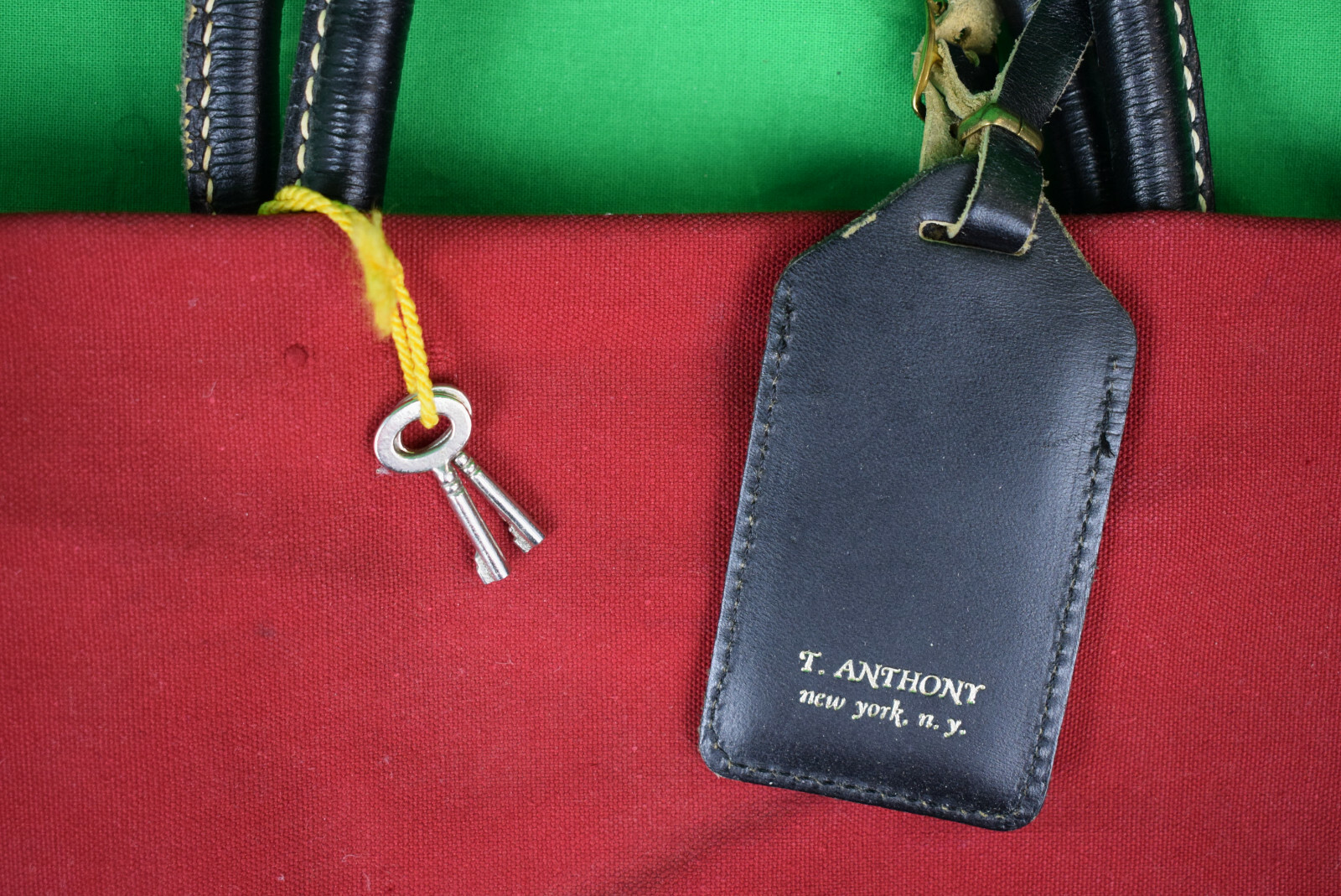 “T. Anthony Red Canvas Carrier Bag w/ Luggage Tag”