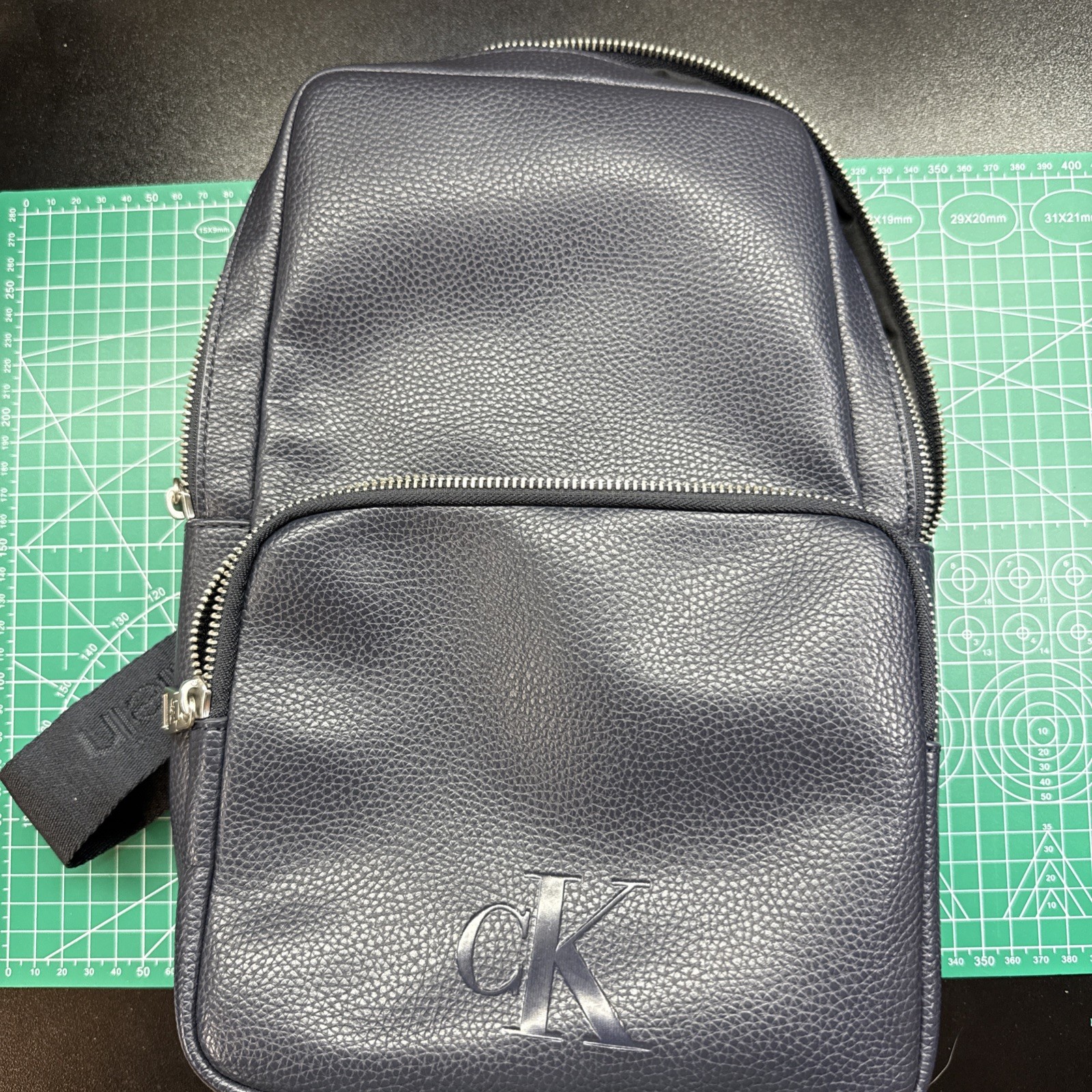 Calvin Klein Unisex All Day Sling Bag – Faux Leather- Dark Navy Blue