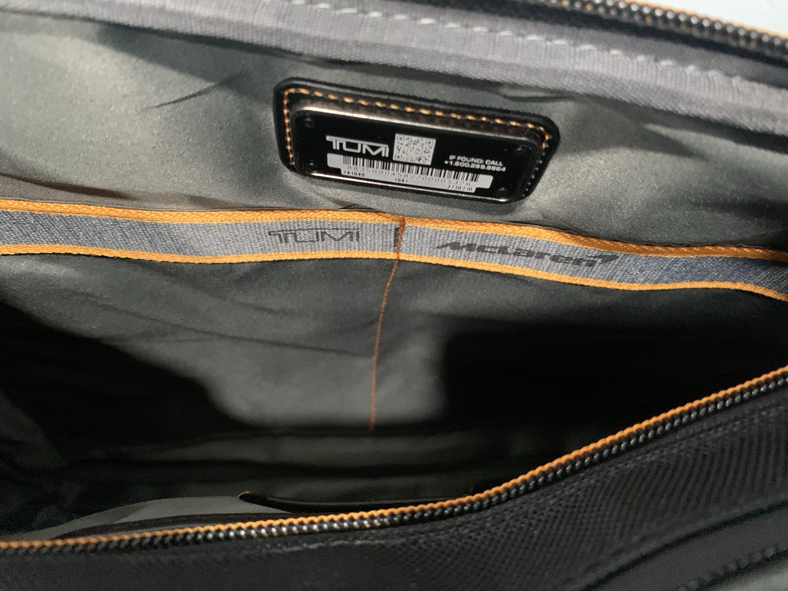 TUMI MCLAREN Axle Slim Brief $1095 Black/Orange