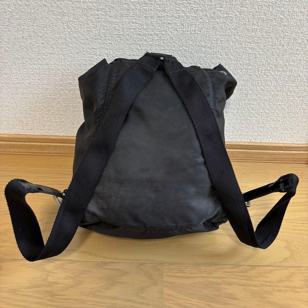 Prada Rucks Saffiano Triangular Plate