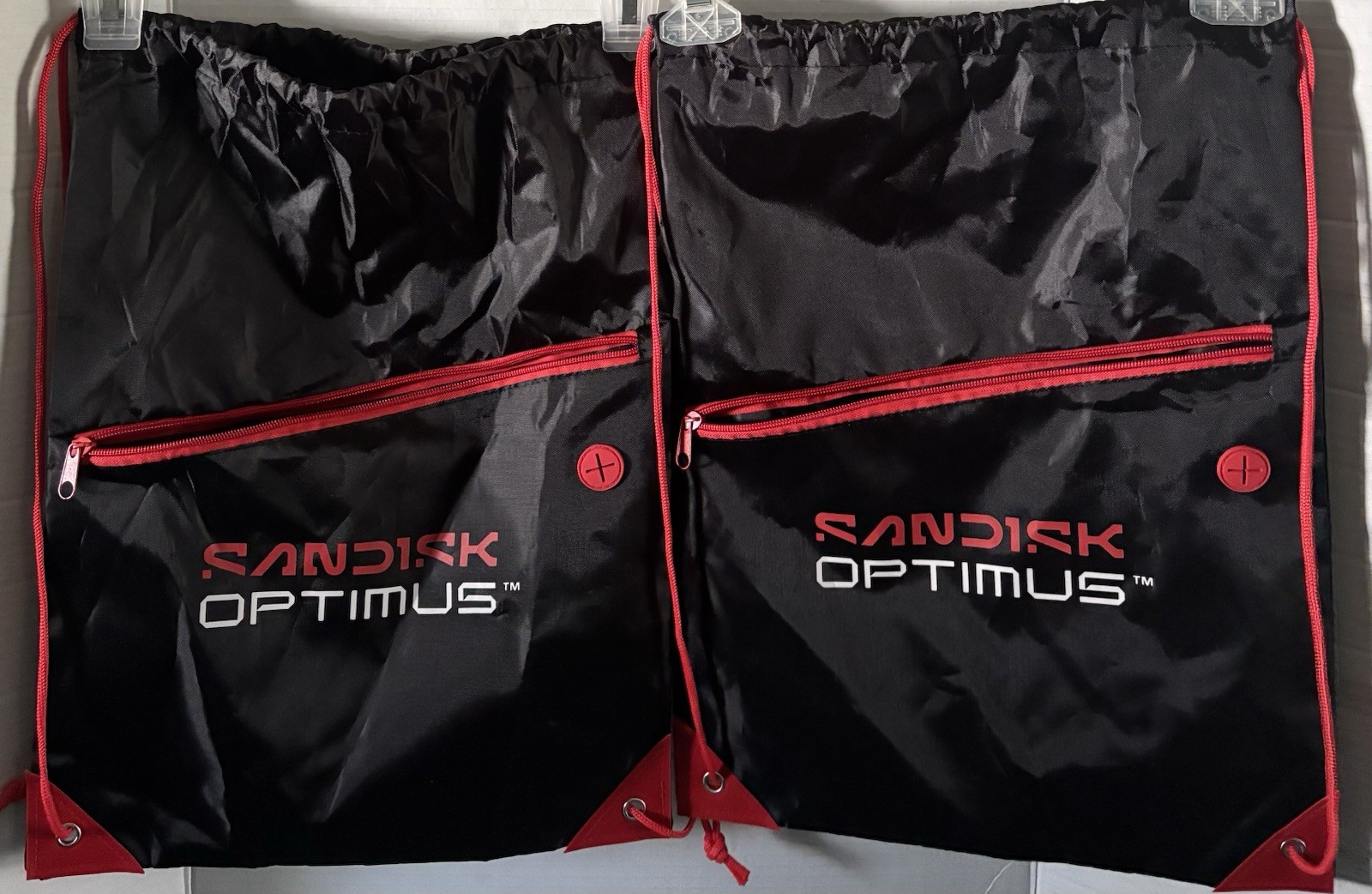 2 Pack Cinch Drawstring Backpack Bag W/Zippered Pocket And SanDisk Optimus Logo
