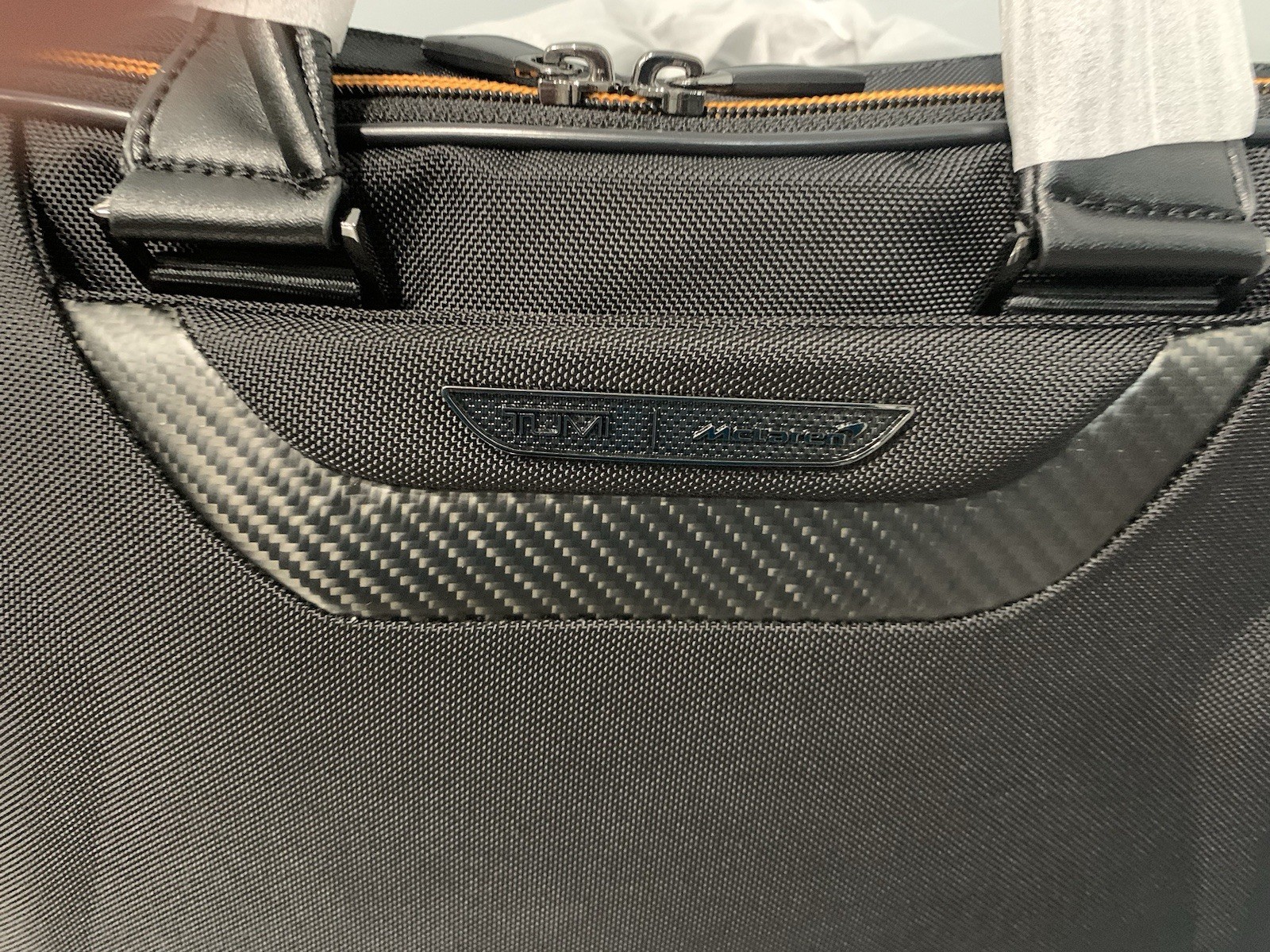 TUMI MCLAREN Axle Slim Brief $1095 Black/Orange