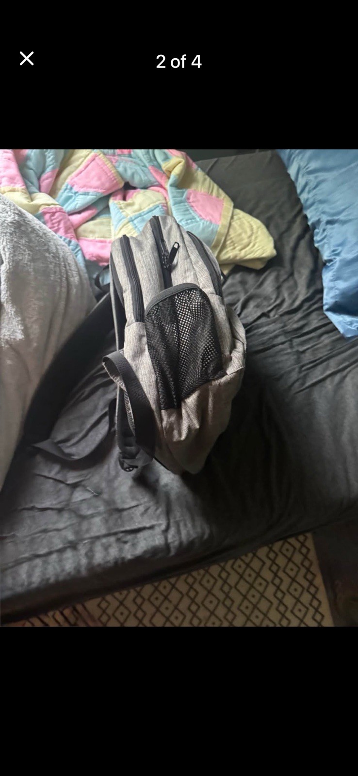 Grey backpack 6 inches deep 12 inches wide and 15 inches tall