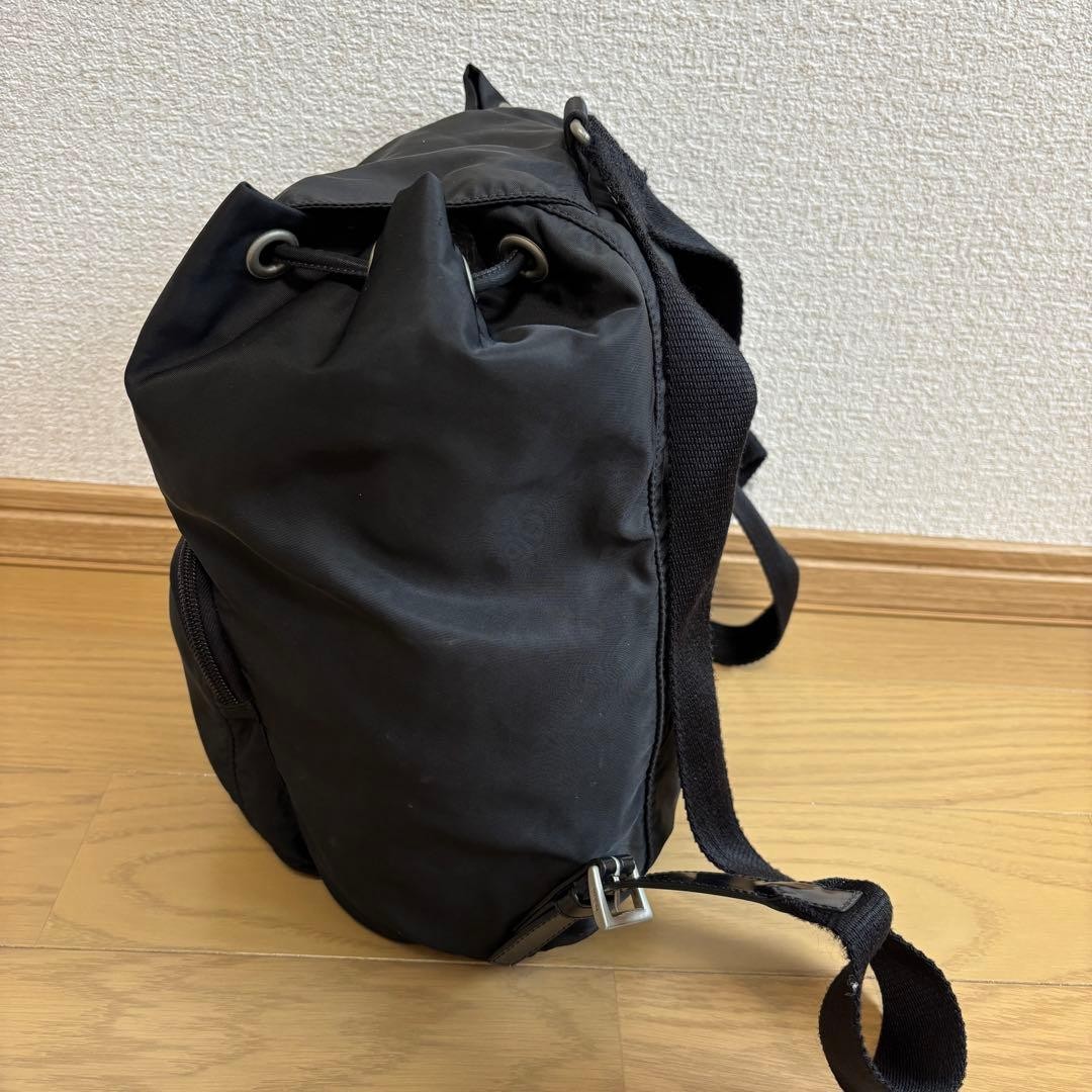 Prada Rucks Saffiano Triangular Plate