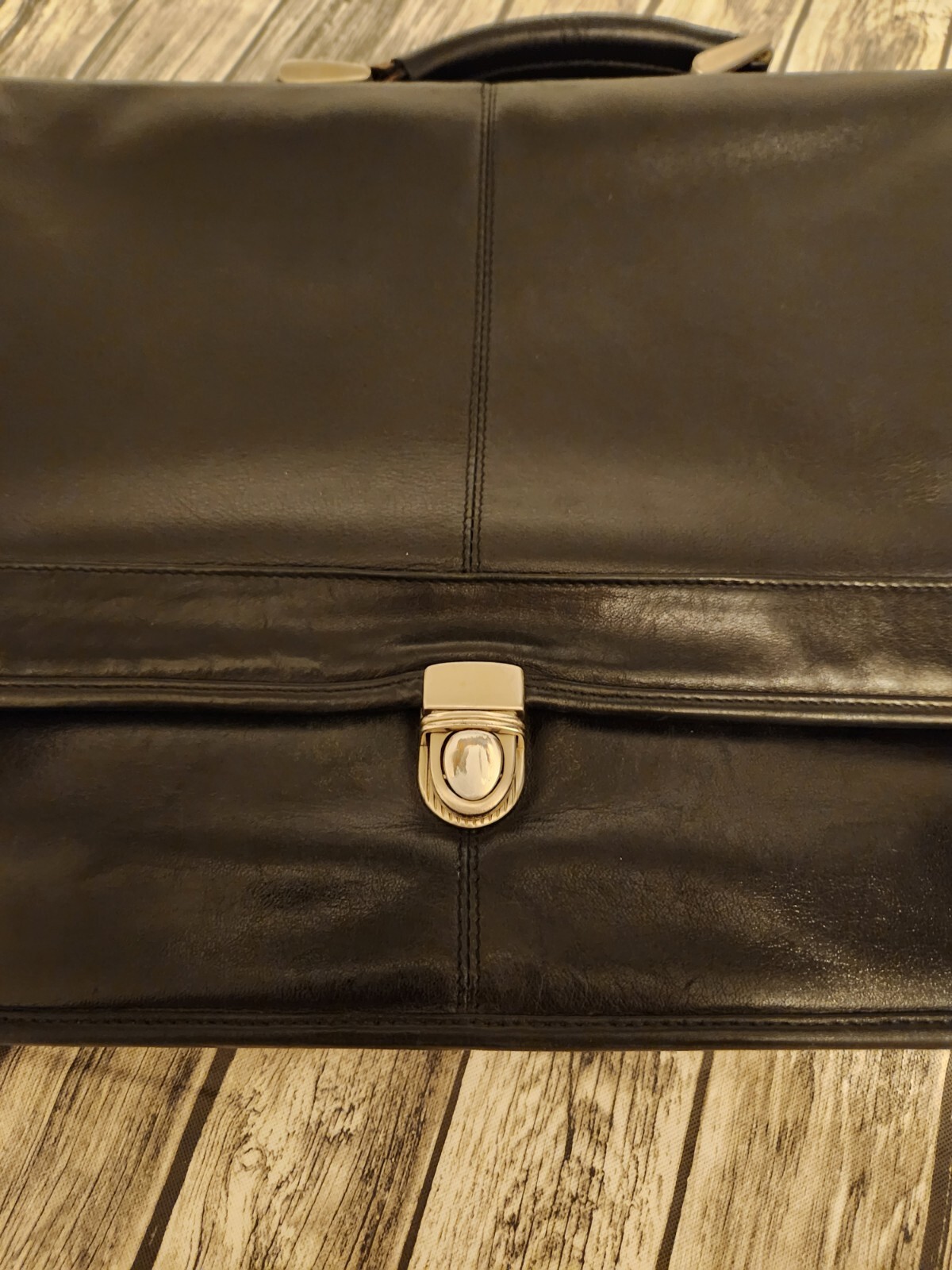Black leather briefcase. Soft, Expands. W/ shoulder Strap