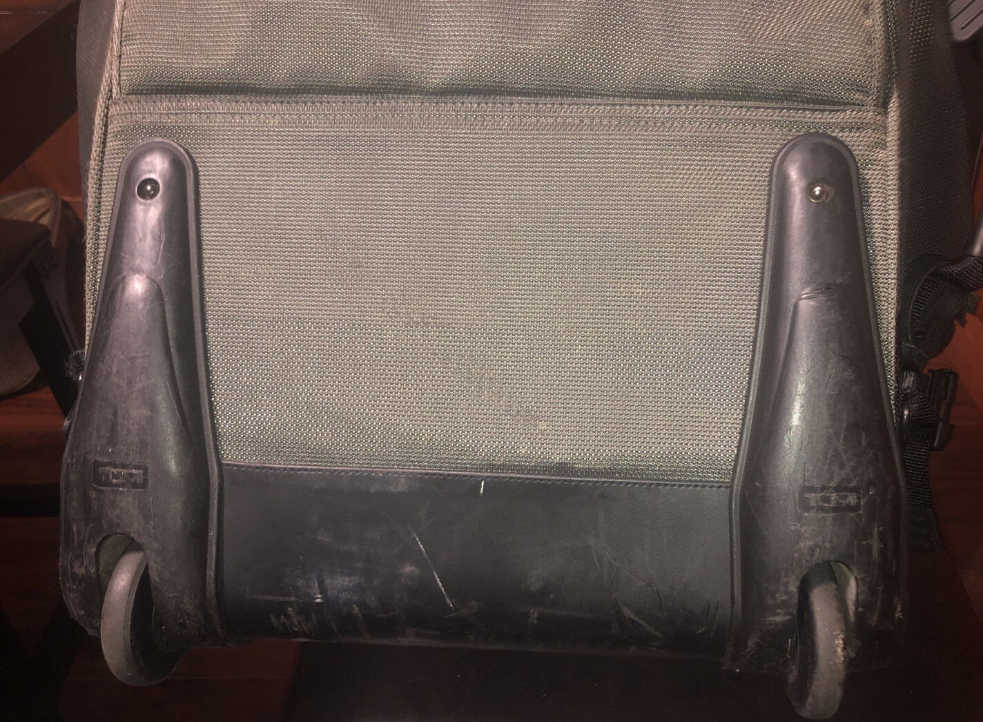 Used Tumi T2 Nylon Olive Green and Black Backpack Suitcase With Wheels.