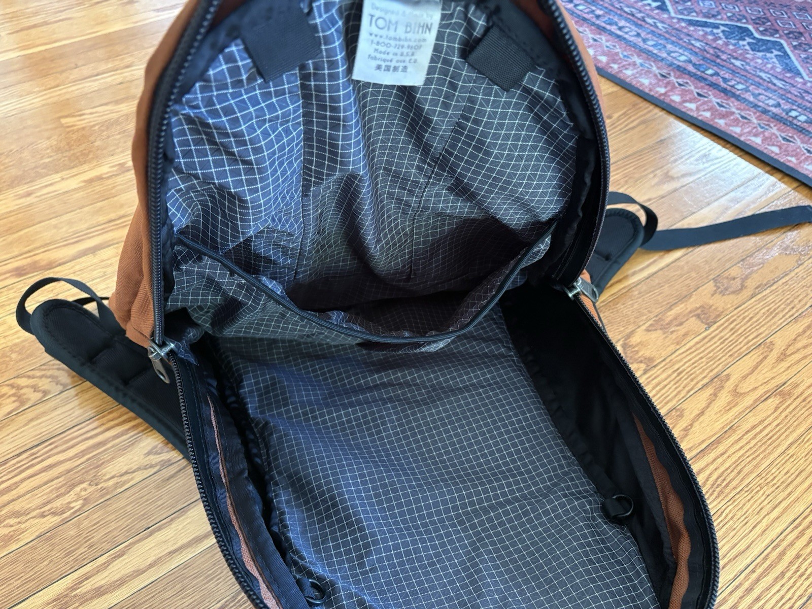 TOM BIHN Synapse 25 Backpack Burnt Orange Ballistic With Steel Interior