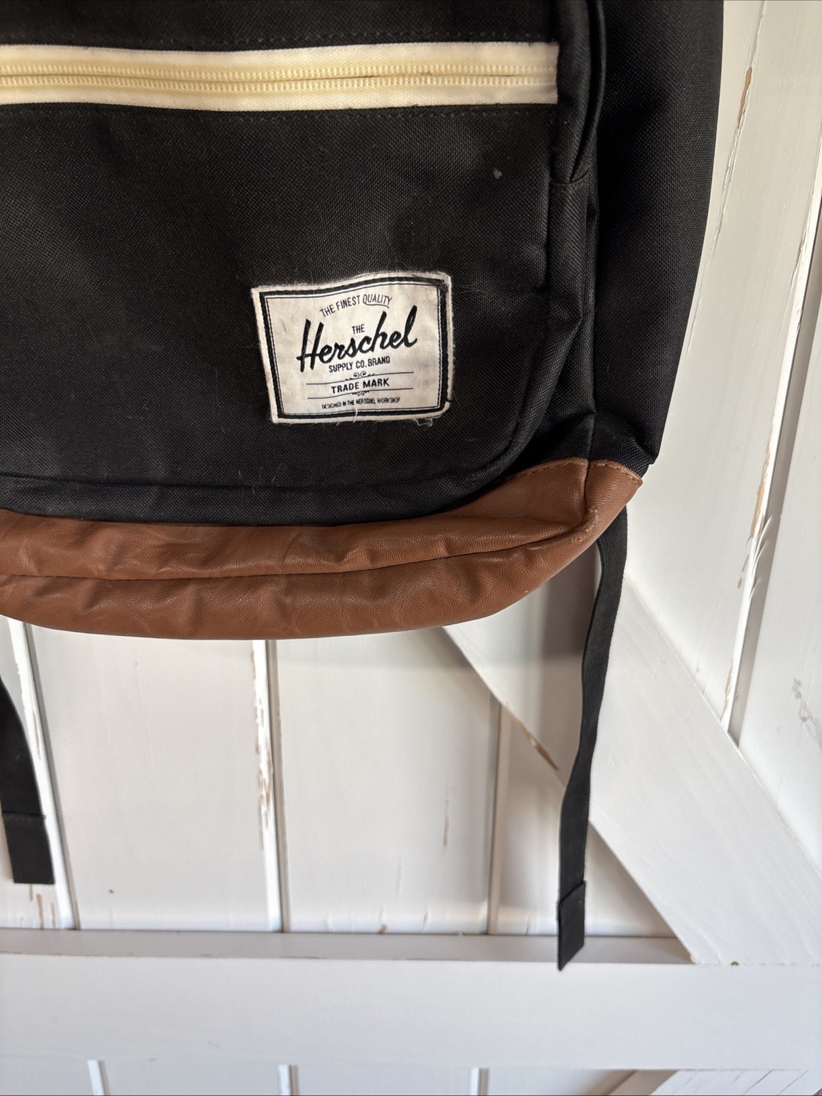 Herschel Supply Co. Pop Quiz backpack Black body with a brown synthetic leather