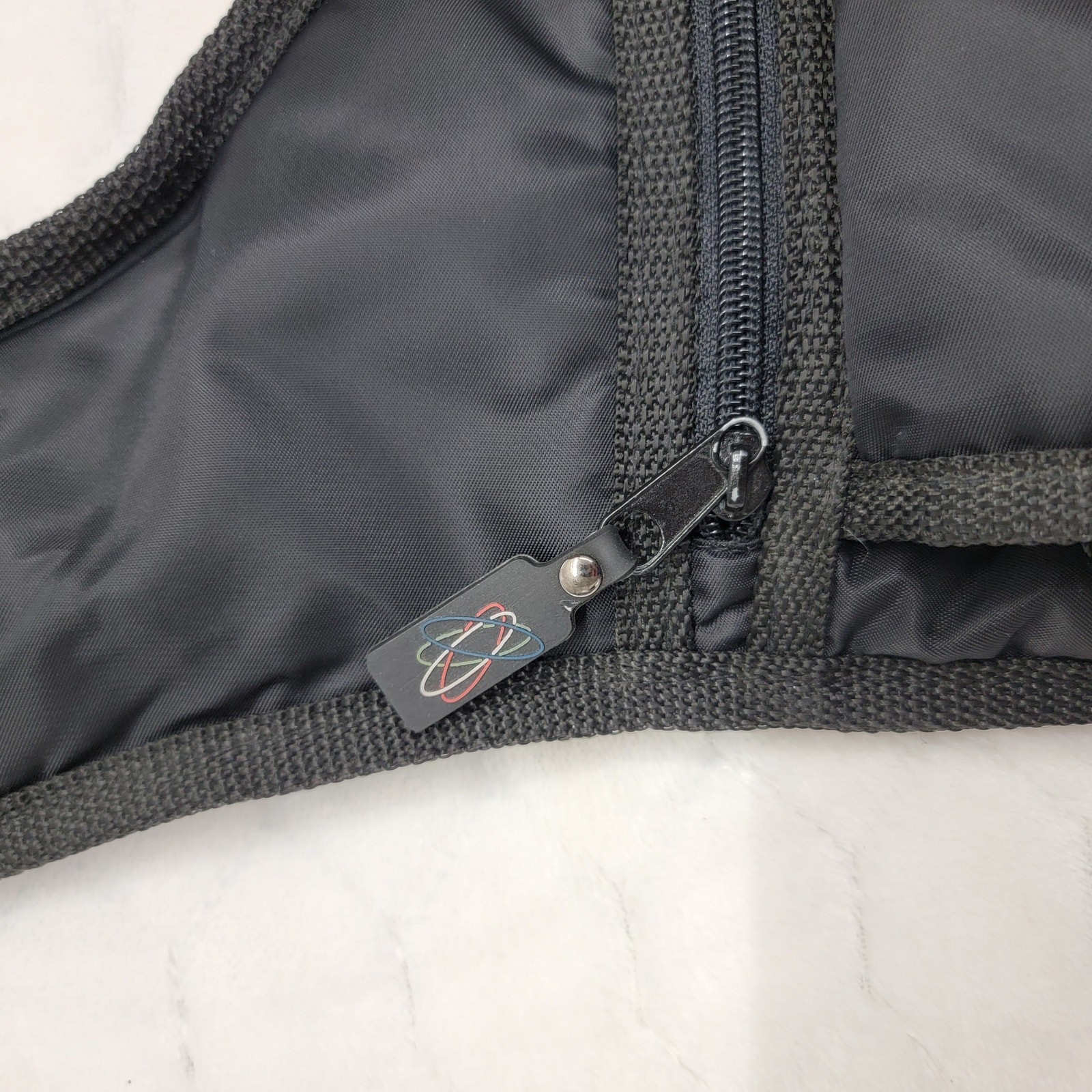 Vintage Y2K Black Nylon Sling Messenger Bag Techwear Quilted Atomic Logo Cyber