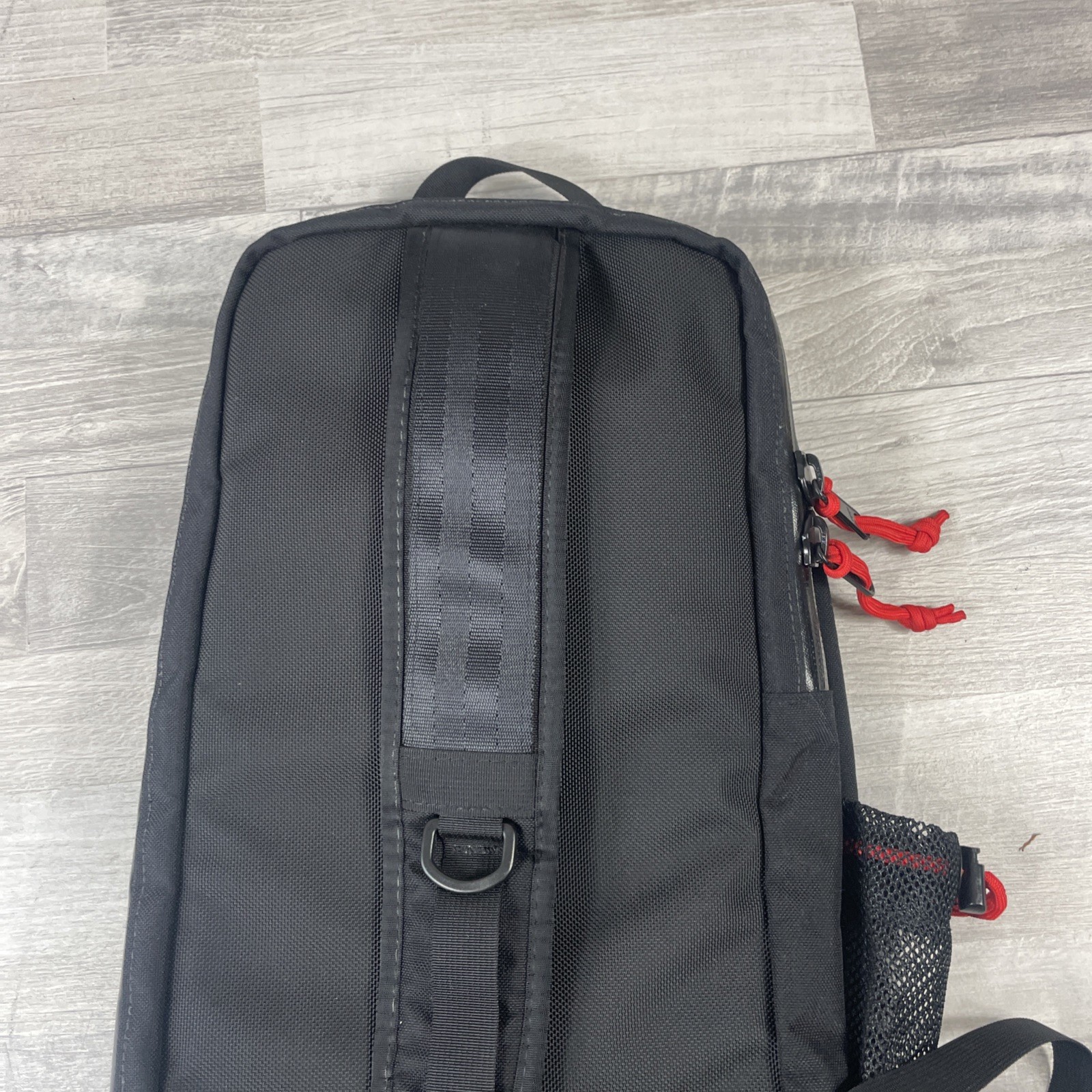 Topo Designs 13L Sling Bag Crossbody Pack with Laptop Sleeve in Black and Green