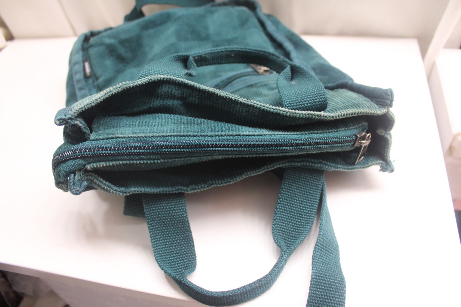 Vans Mini Free Hand backpack in a deep teal corduroy Checkerboard 10X11X3inches