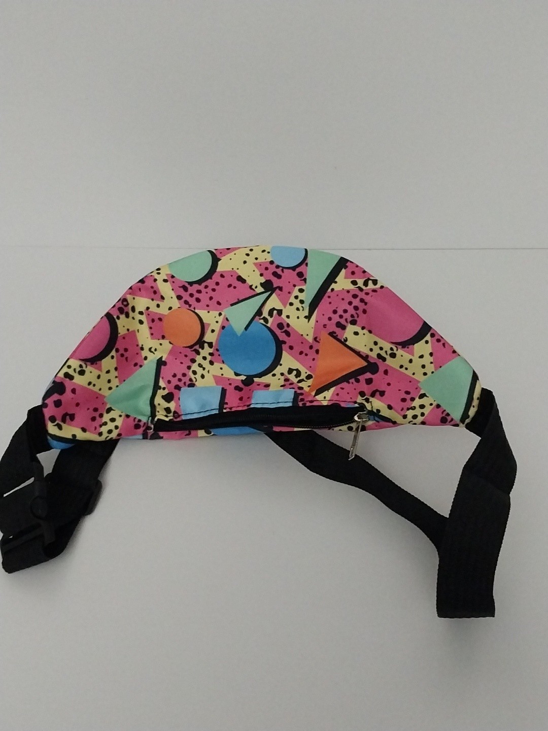 80s or 90s style Memphis pattern fanny pack with a black adjustable strap and…