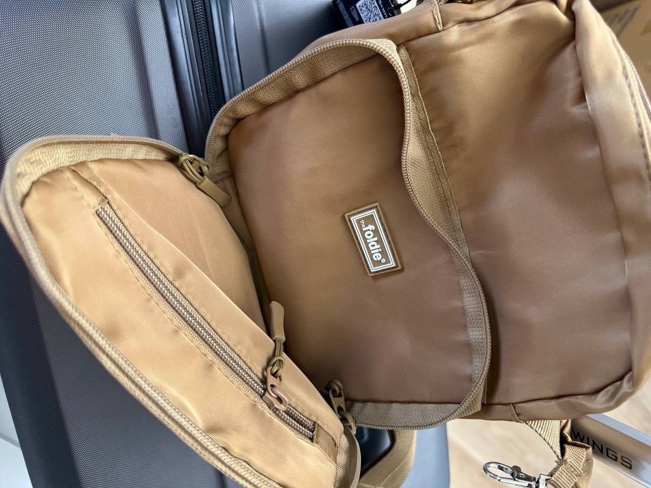 the foldie Small Brown Crossbody Sling Bag Zip Pockets Lined Adjustable Strap