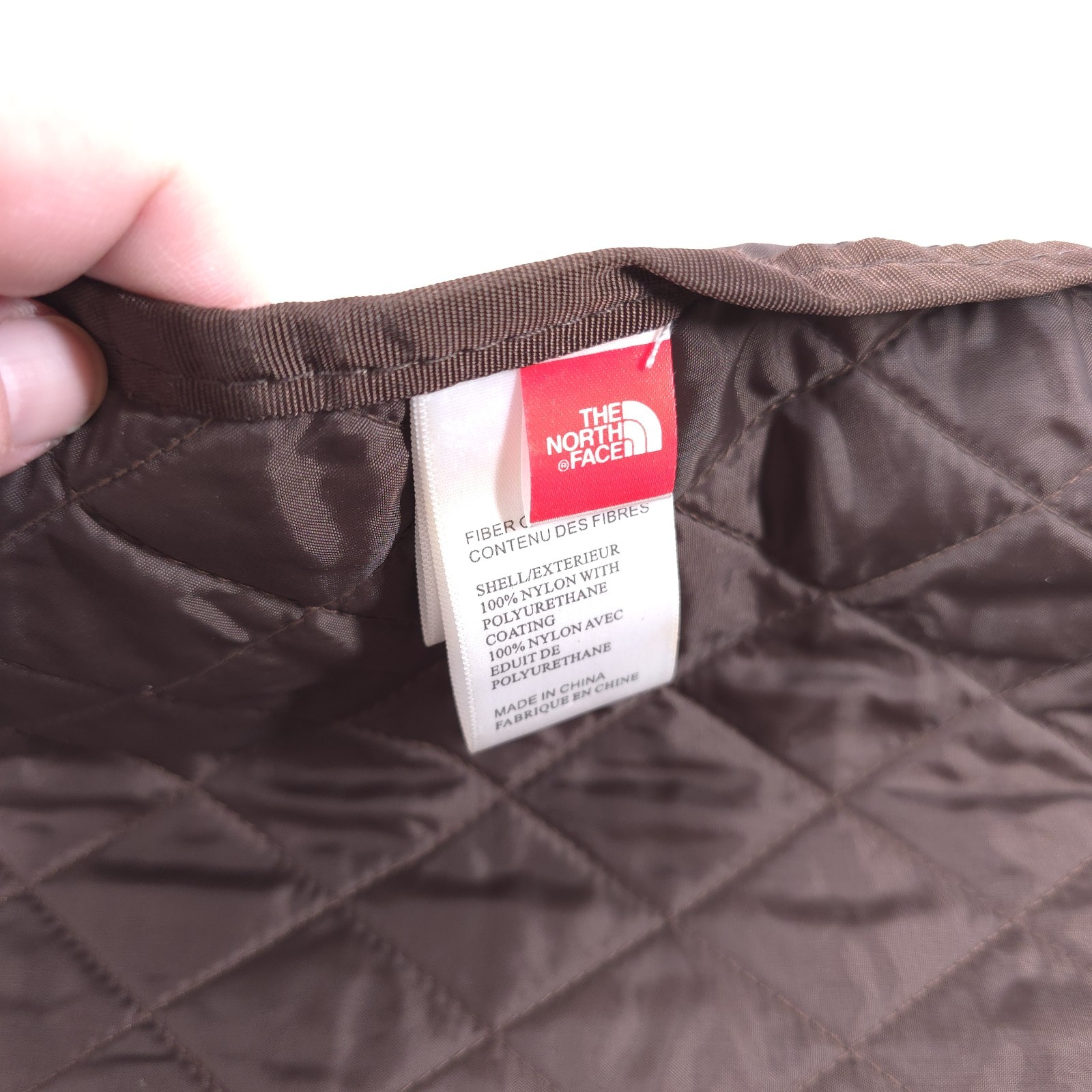 The North Face Quilted Drawstring Bag — Brown