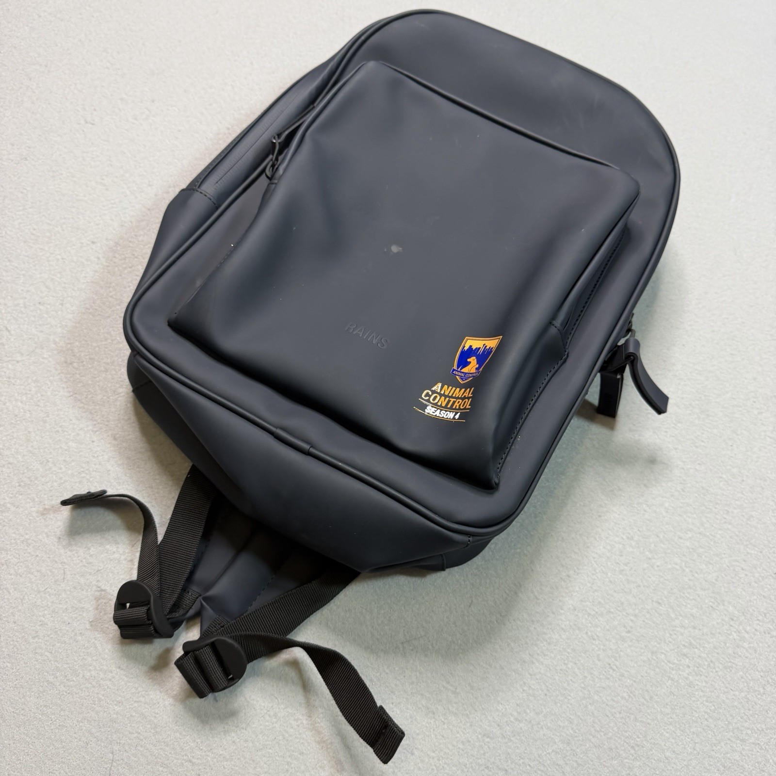 Rains Travel Matte Black Backpack Animal Control Season 4 Fox