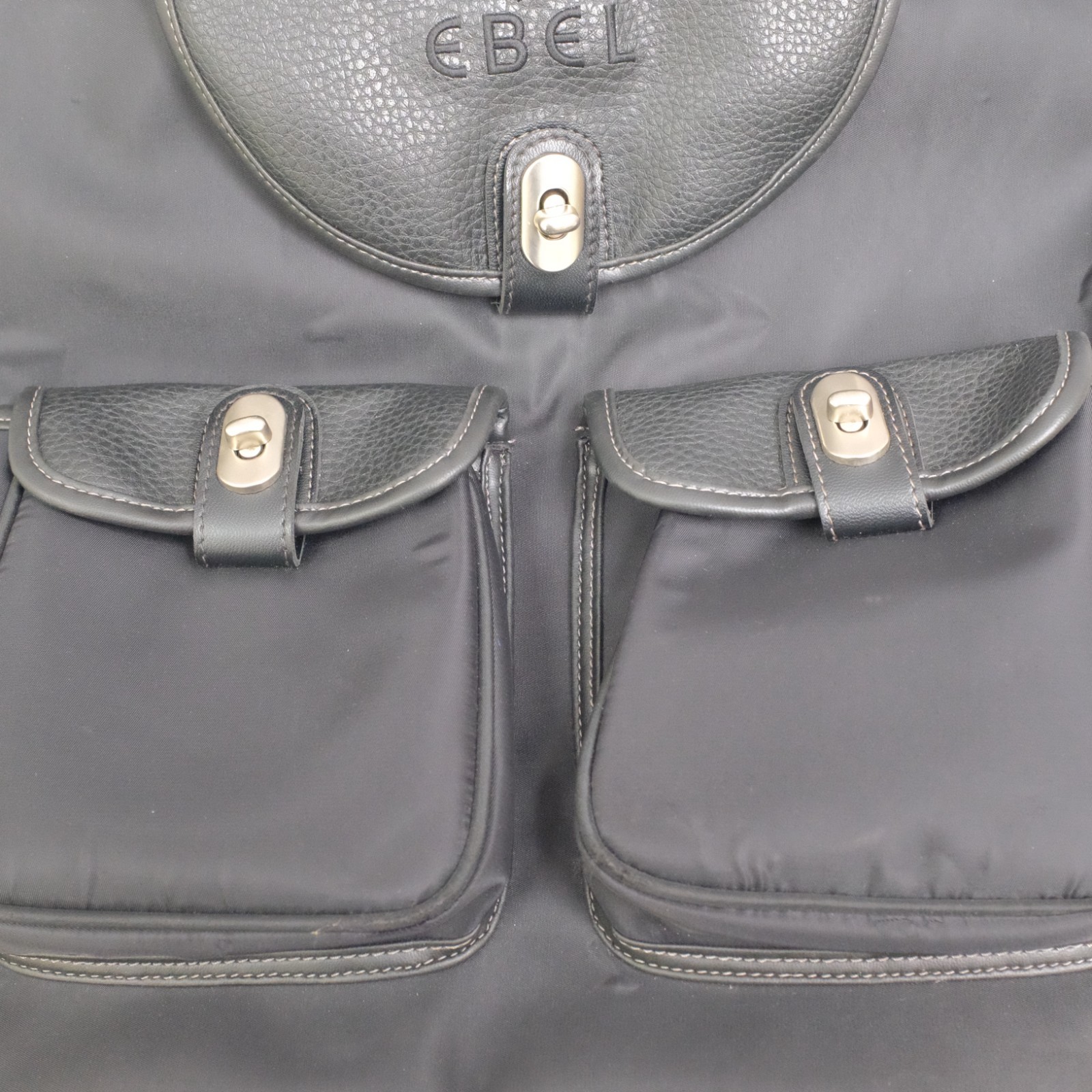 Ebel Black Nylon Faux Leather Turn Lock Cinch Top Travel Backpack