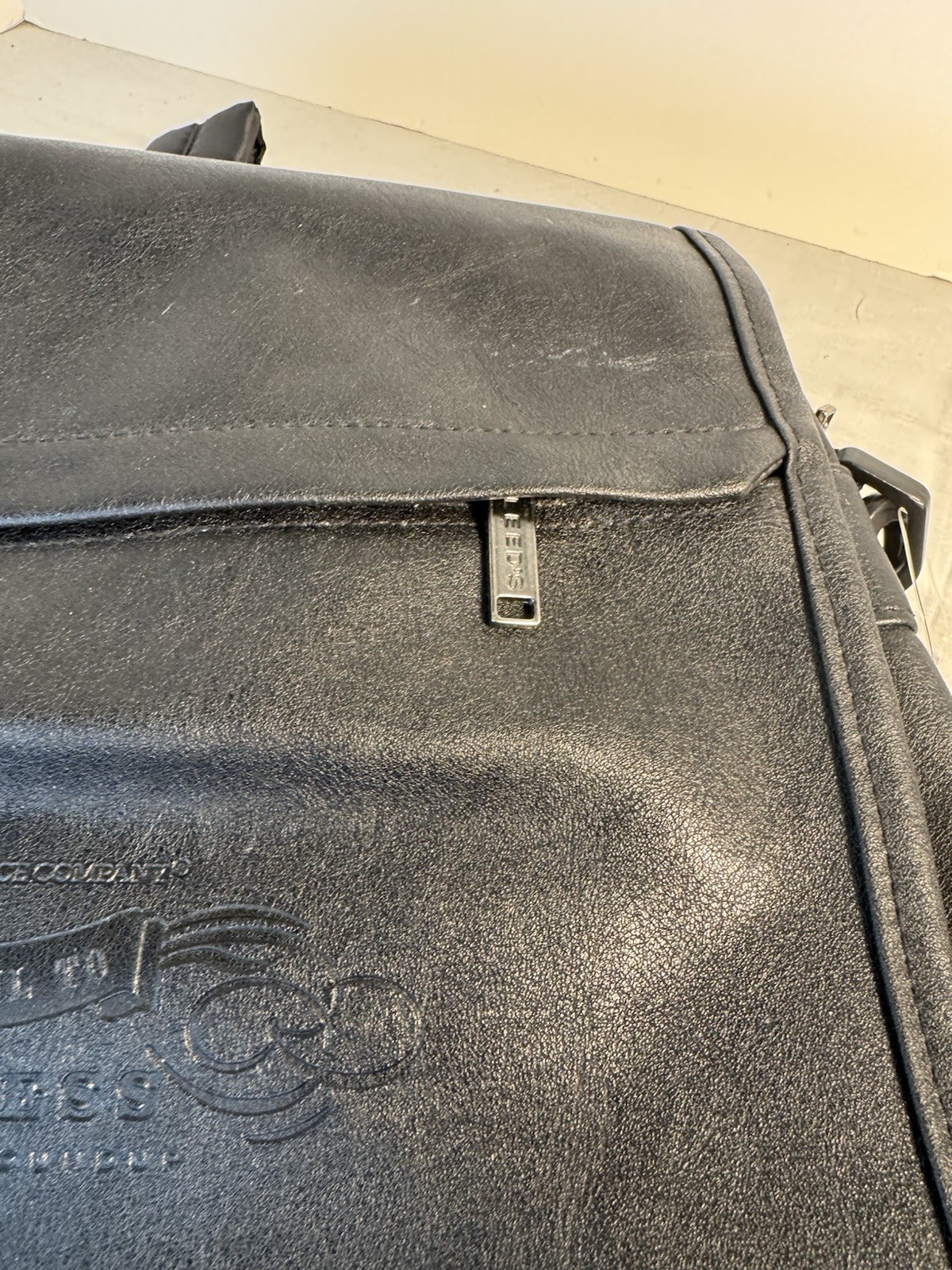 Solid Black leather messenger bag With Inside Pockets And Back Pack Handles