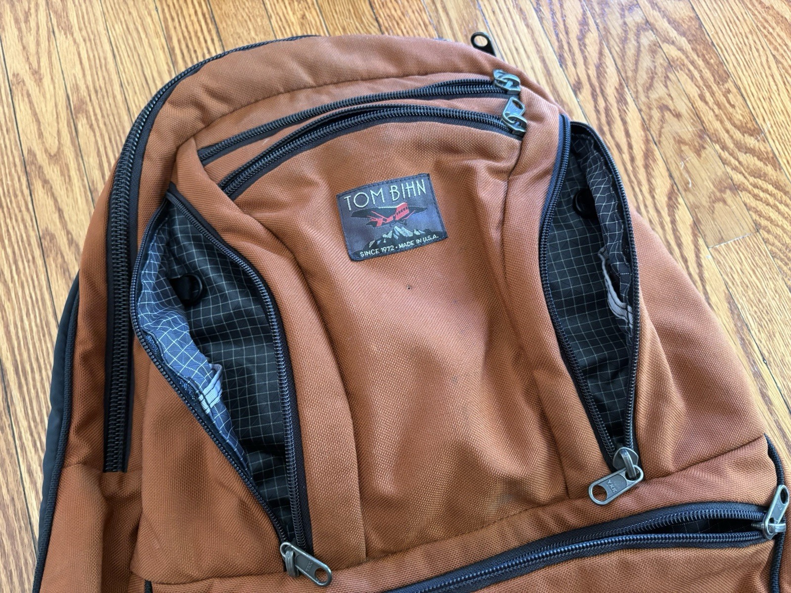 TOM BIHN Synapse 25 Backpack Burnt Orange Ballistic With Steel Interior