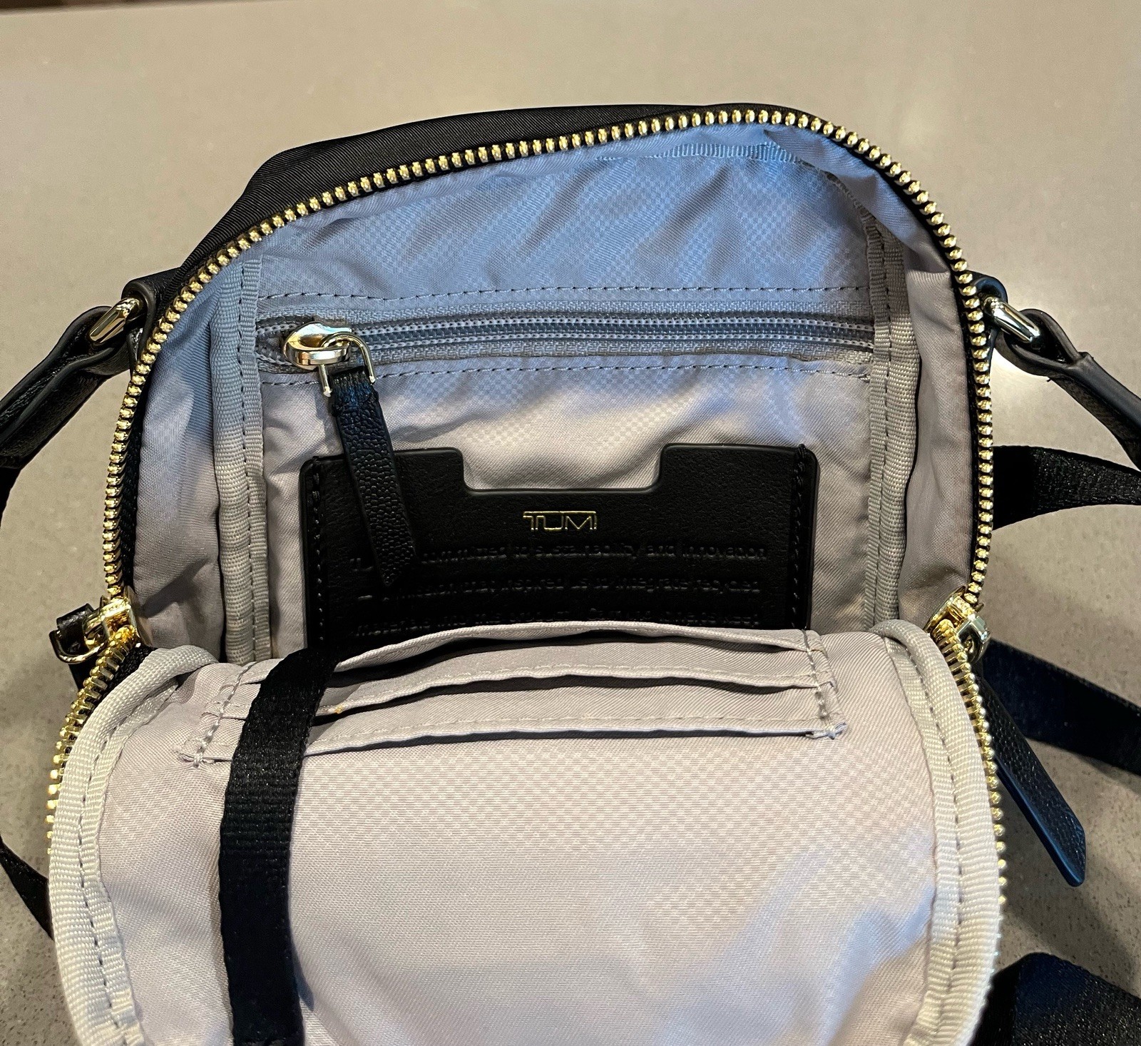 TUMI Black Small Crossbody Bag Adjustable Strap Zip Closure Pockets