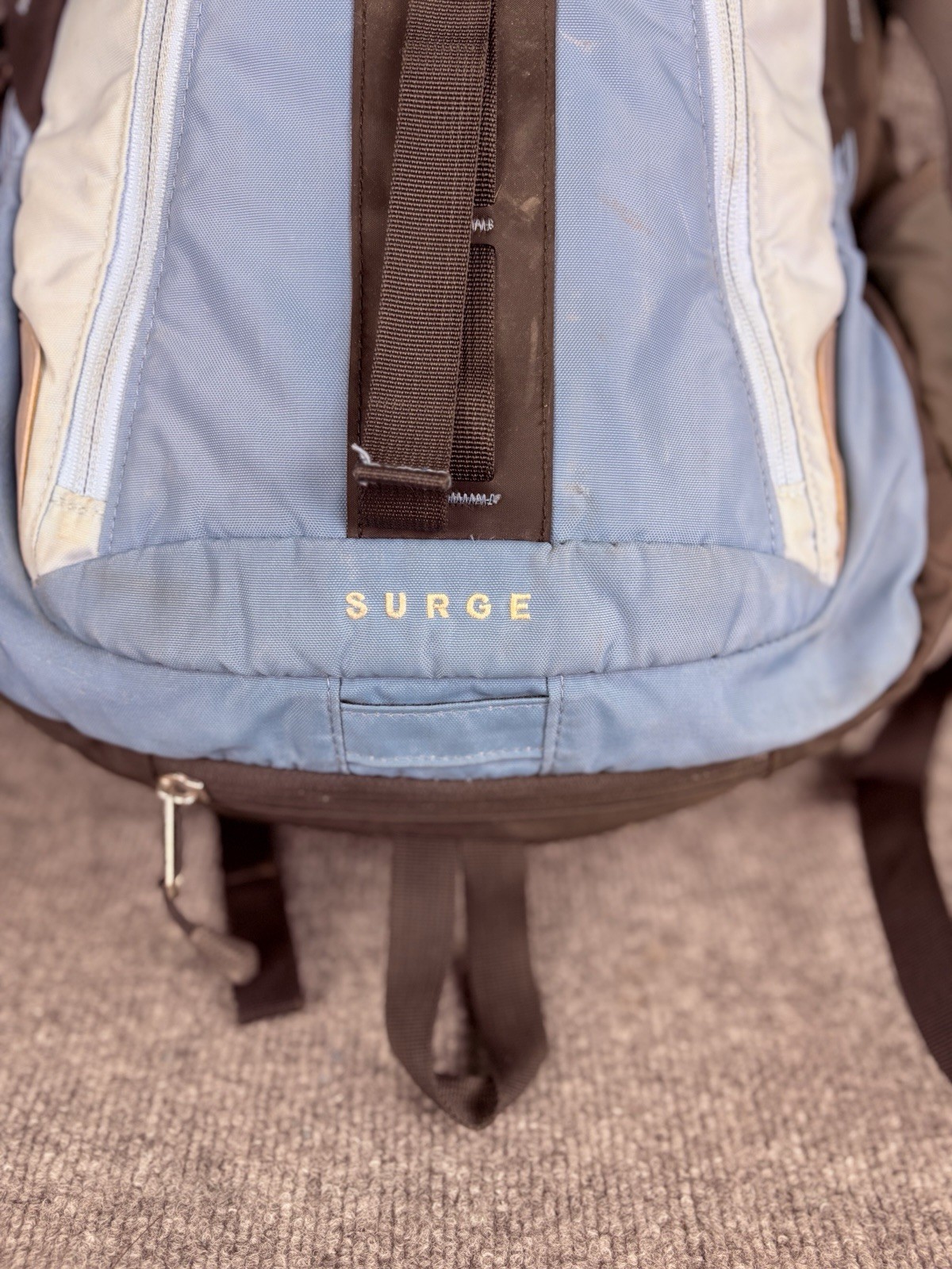 The North Face Surge Backpack Sky Blue Front Grey Back And Green Side Pockets