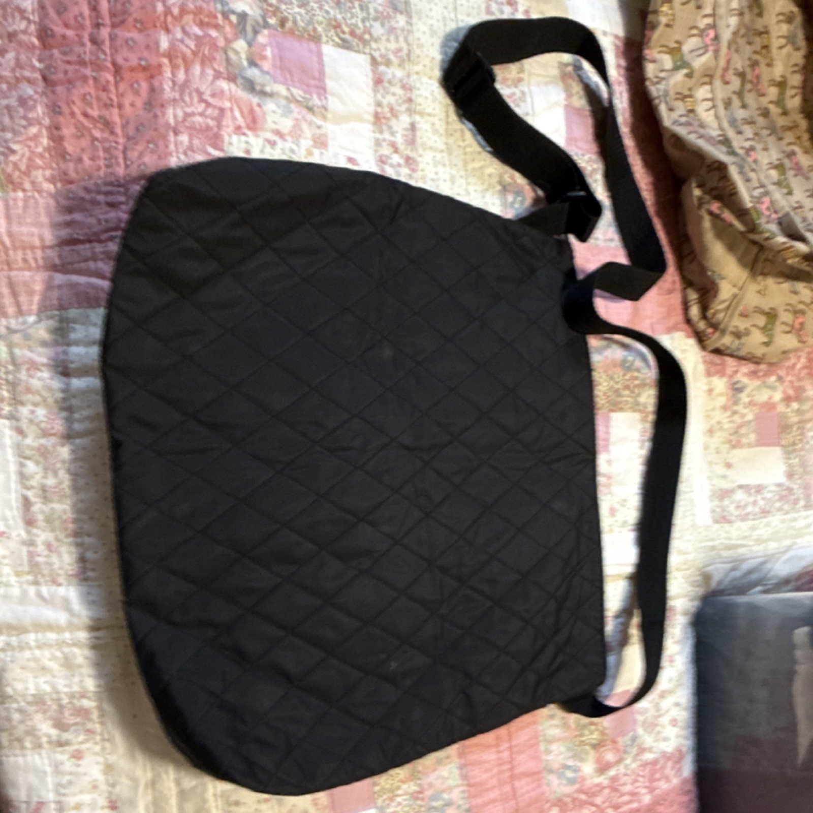 Black Quilted Shoulder Bag with Adjustable Strap and Zipper Closure