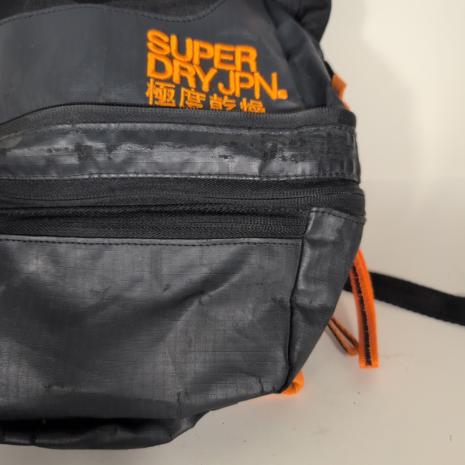 Superdry Tarp Backpack Black Orange Trim Travel Zip Pockets Water Resistant Bag