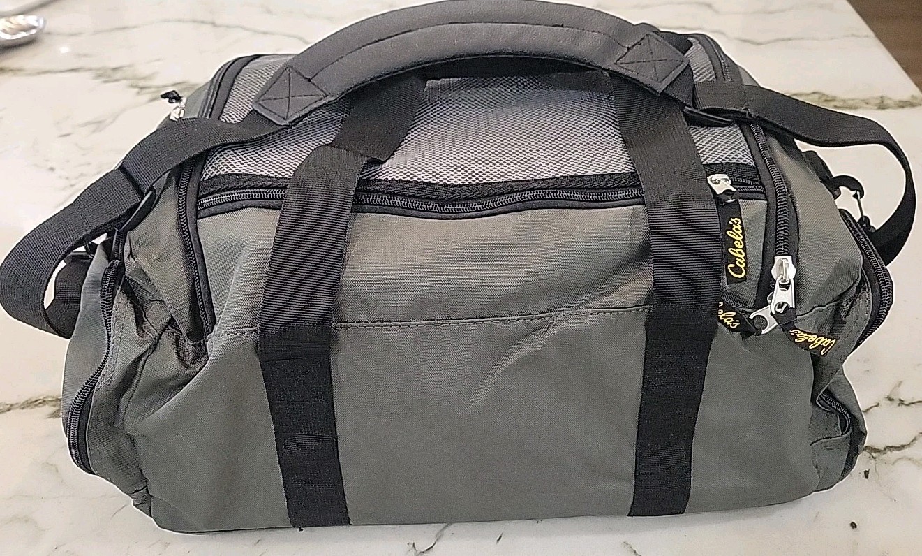 Cabela’s travel bag (6028). Zipper Closure. New. Gray Color. For Man Or Women.