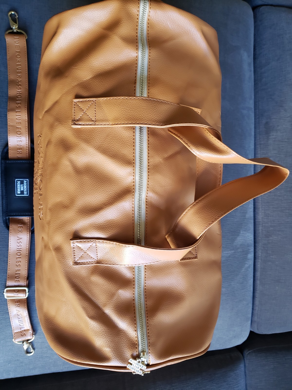 ASSHOLES*S LIVE FOREVER – Emotional Baggage Camel Tan Faux Leather BRAND NEW!