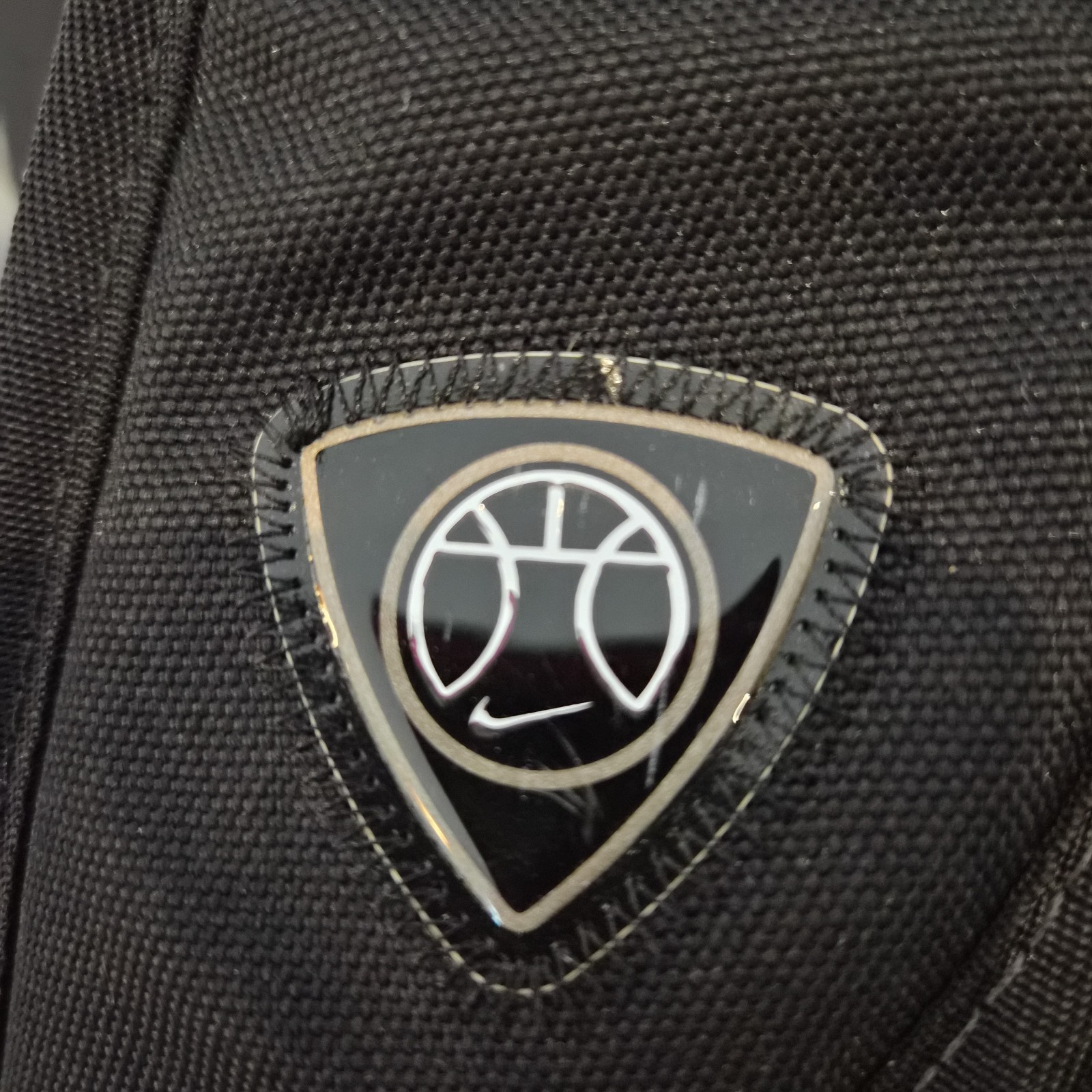 Retro Black and Red Nike Hoops Backpack Holds a Basketball