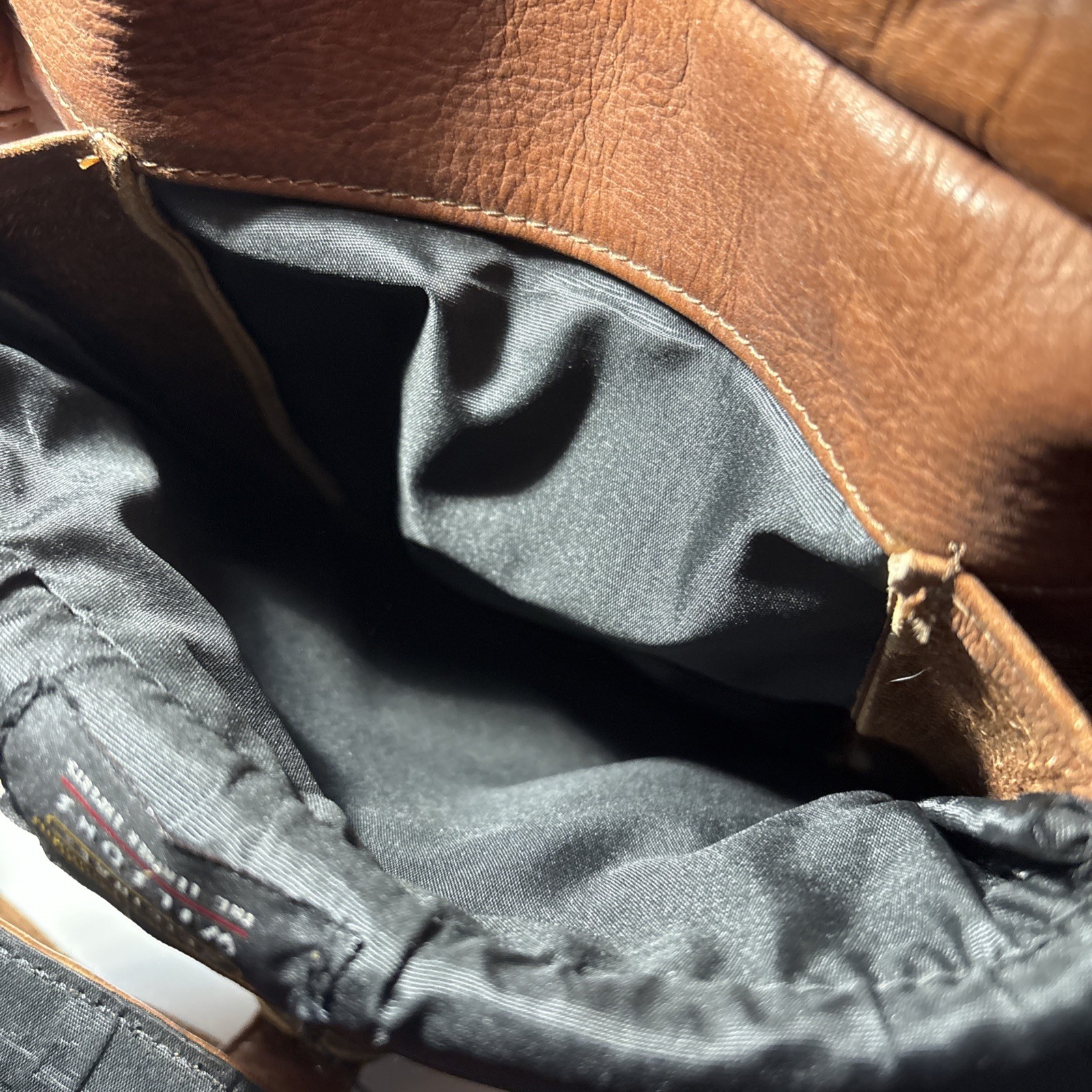 Vintage Wilsons Leather Crossbody Bag with adjustable strap and five pockets