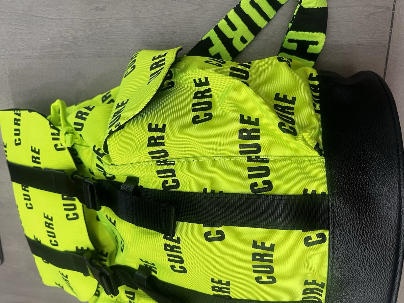 Green/Black CURE Logo Print Backpack Drawstring Buckle Adjustable Straps