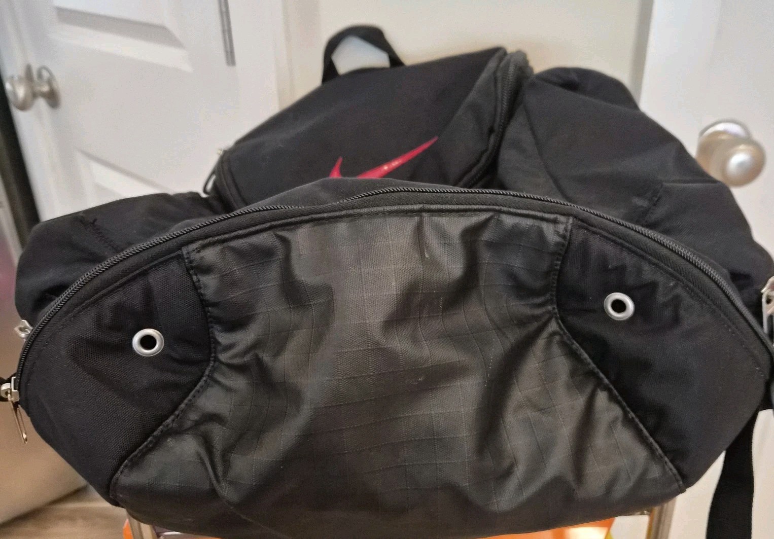 Retro Black and Red Nike Hoops Backpack Holds a Basketball