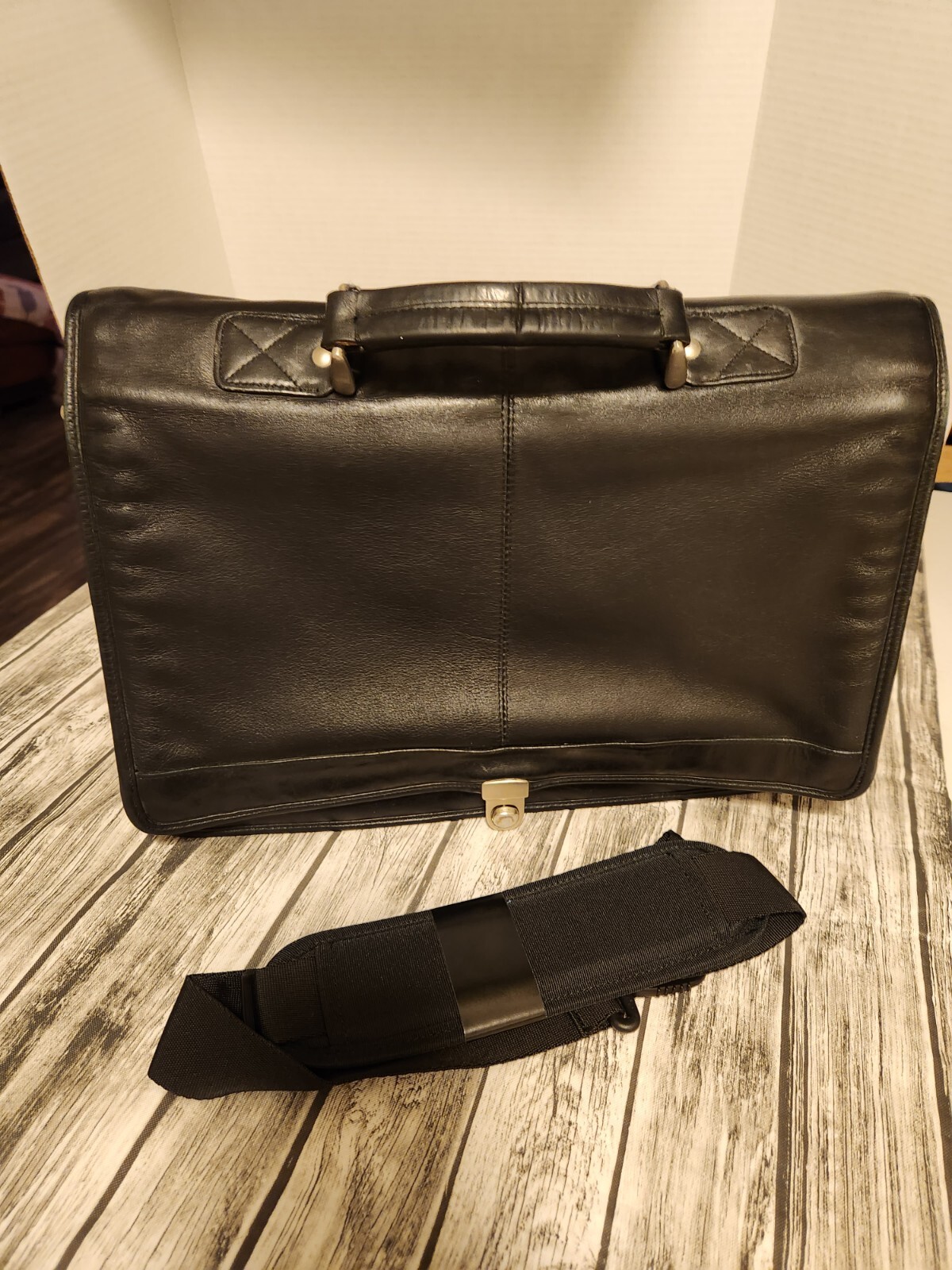 Black leather briefcase. Soft, Expands. W/ shoulder Strap